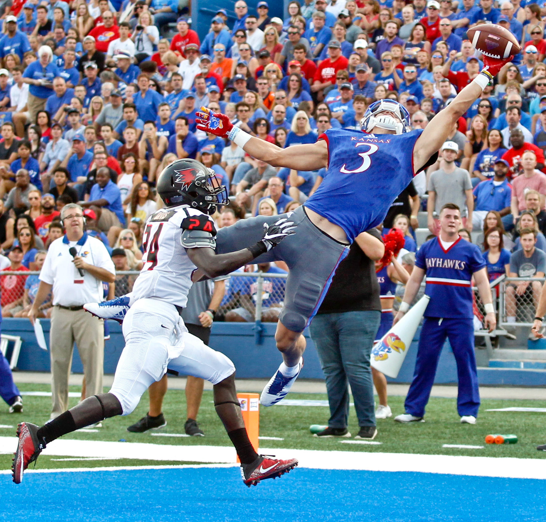 Kansas' Chase Harrell, right, makes a one handed touchdown catch over Southeast Missouri's Shabari Davis during the first half of Saturday night's home opener at Memorial Stadium.