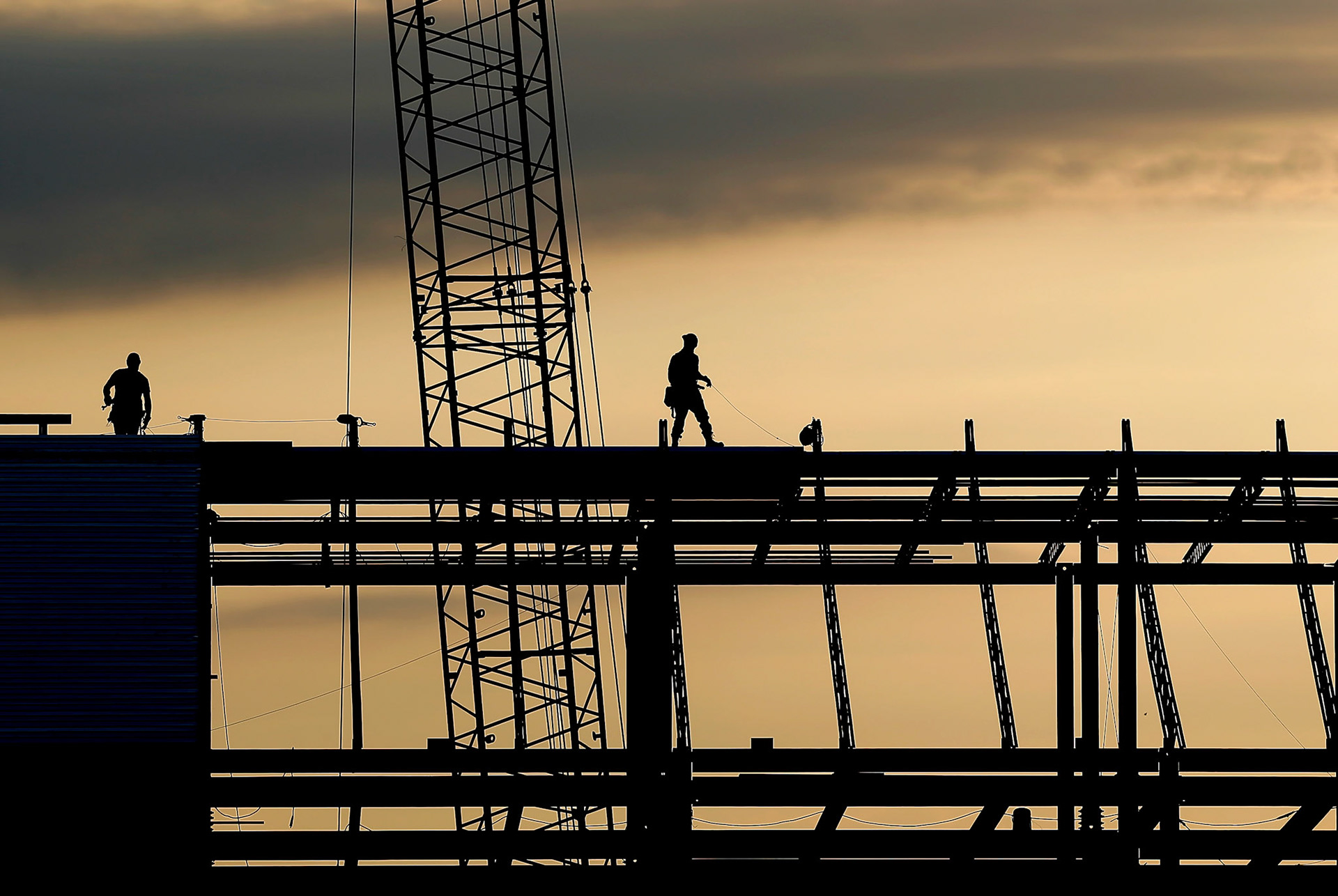 Construction crews work on the roof of what will be the new KBI forensic lab on the Washburn University Campus Thursday morning. The completion of the building is said to be in October 2015.