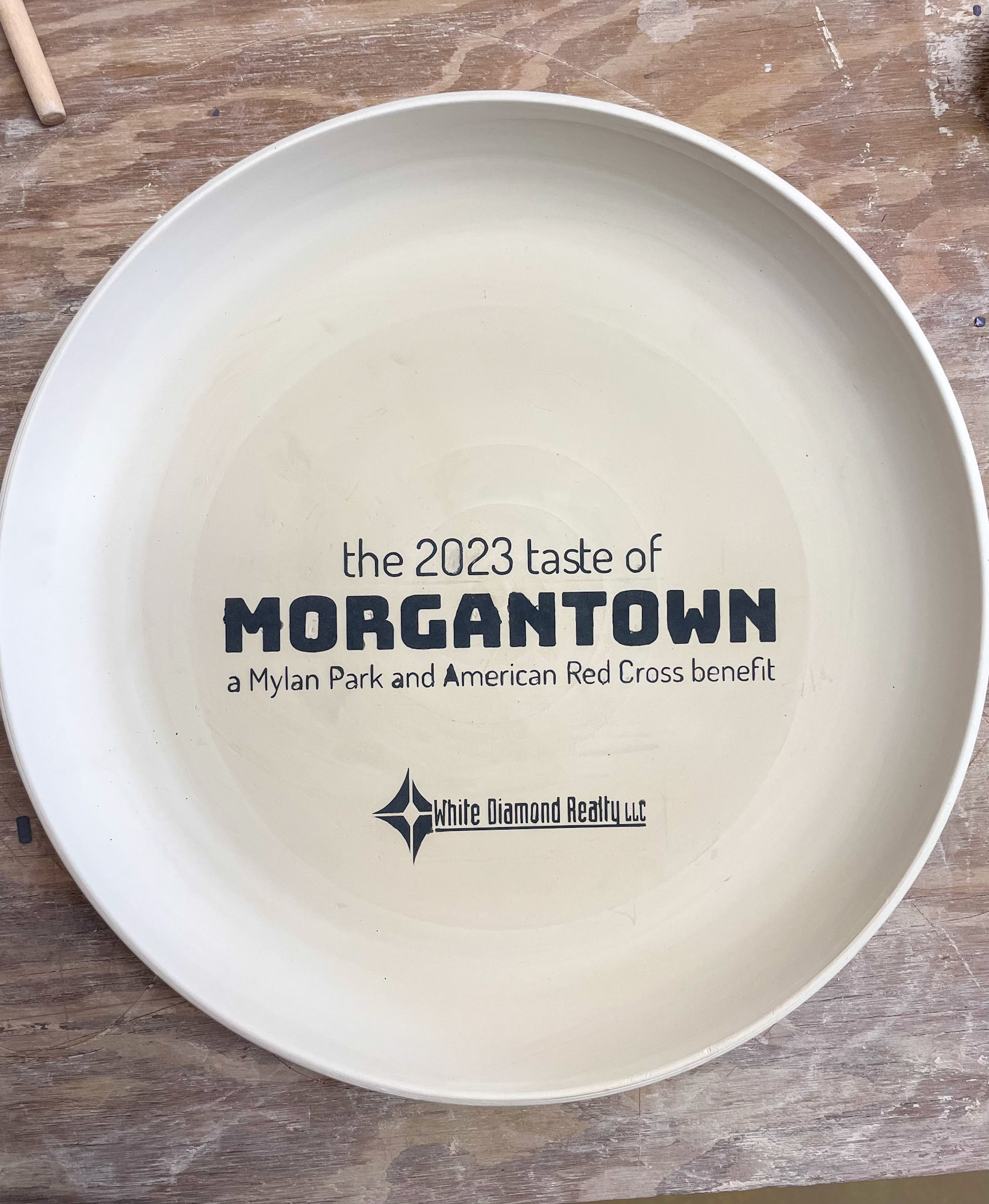 Slip Application of The Taste of Morgantown and Sponsor Logo Stencil Removed