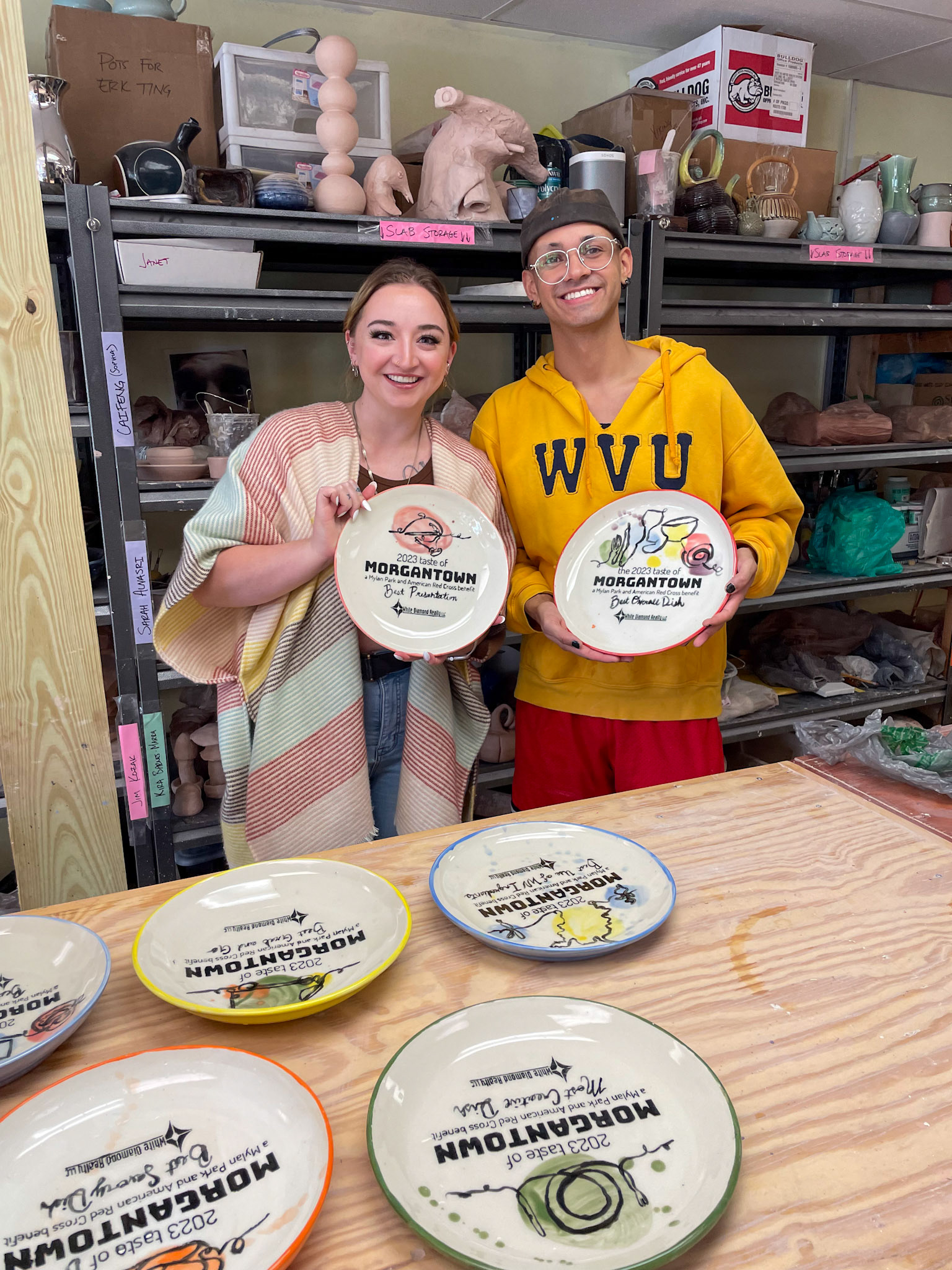 Derek Knight and Macey Lewis Holding Finished Award Plates