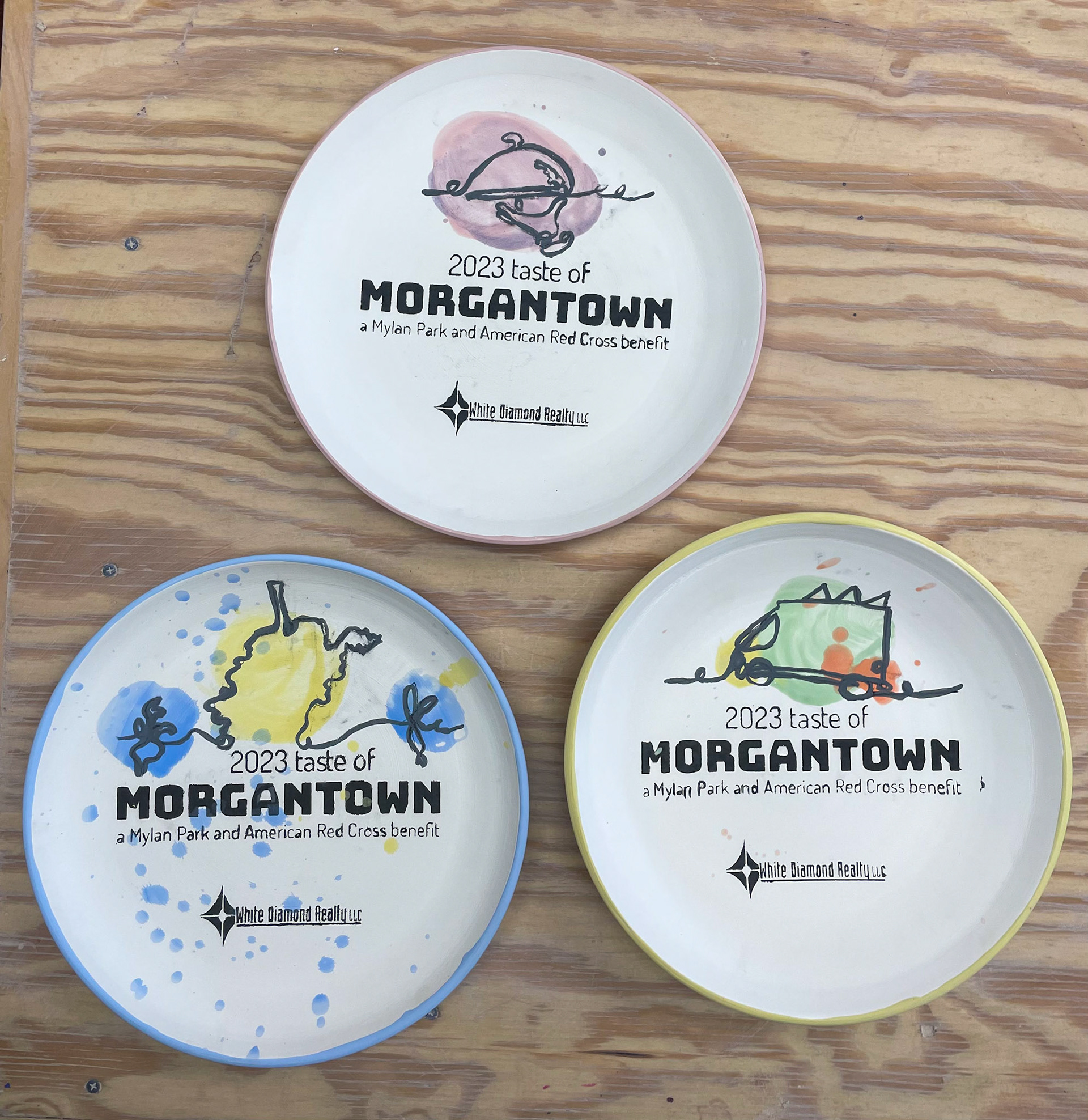 3 Plates with Slip Logos and Underglaze Art