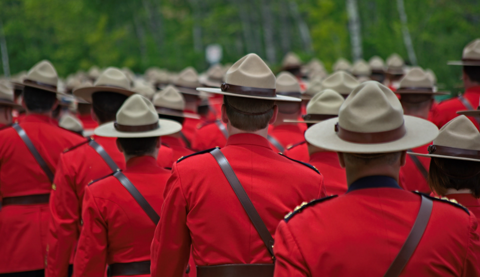 Procession of RCMP police officers making their way to the Moncton Coliseum for the regimental funeral of three New Brunswick Mounties killed in the line of duty: constables Fabrice Georges Gevaudan, Douglas James Larche and Dave Joseph Ross.