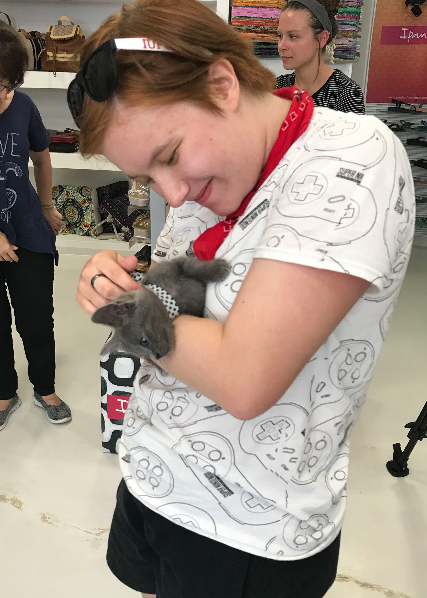 Myself holding Arouraíos, a foster kitten