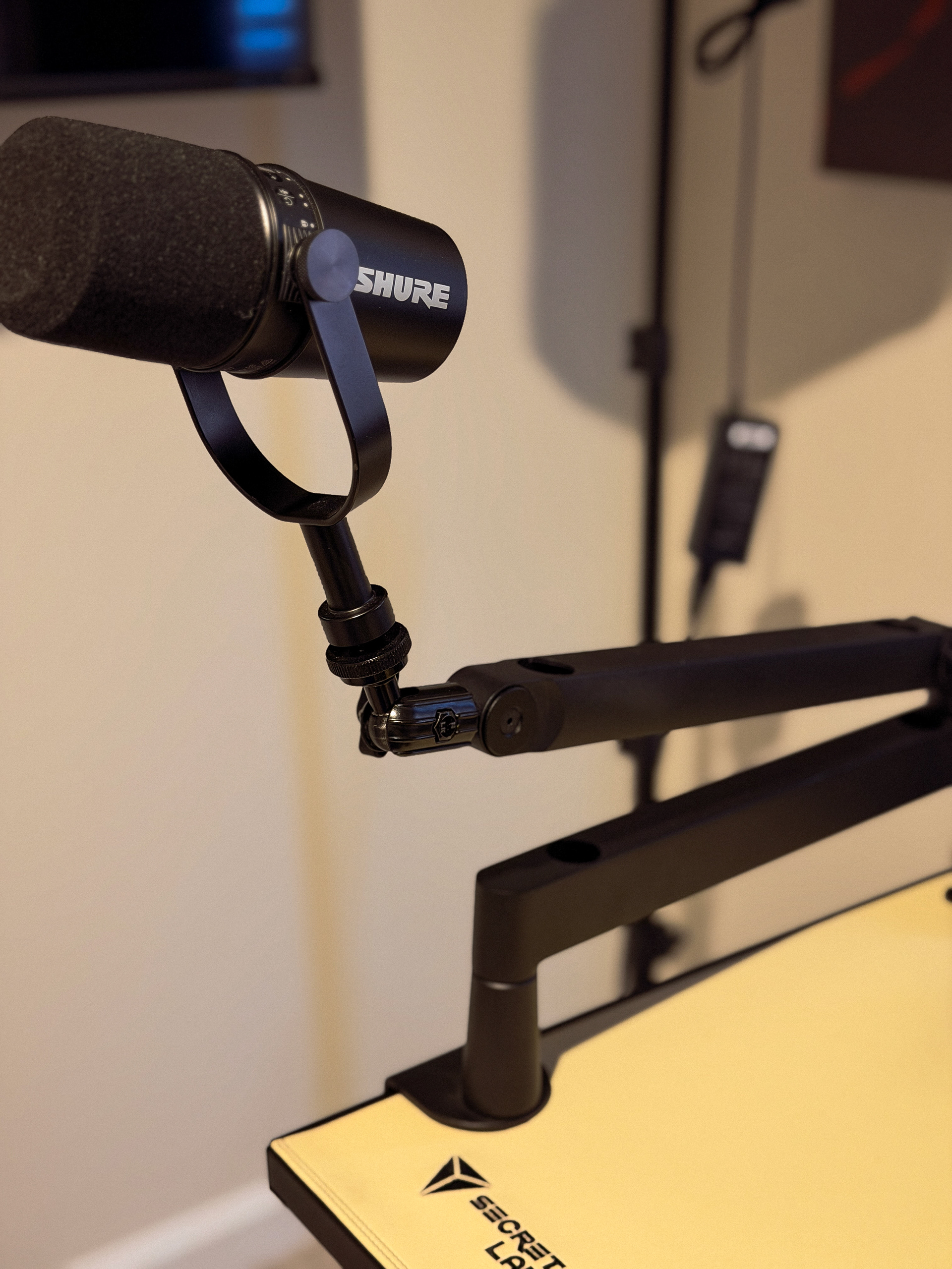 Shure MV7 Microphone: If the audio isn't right, nothing else matters. This gives me that rich, radio sound without a complicated setup.