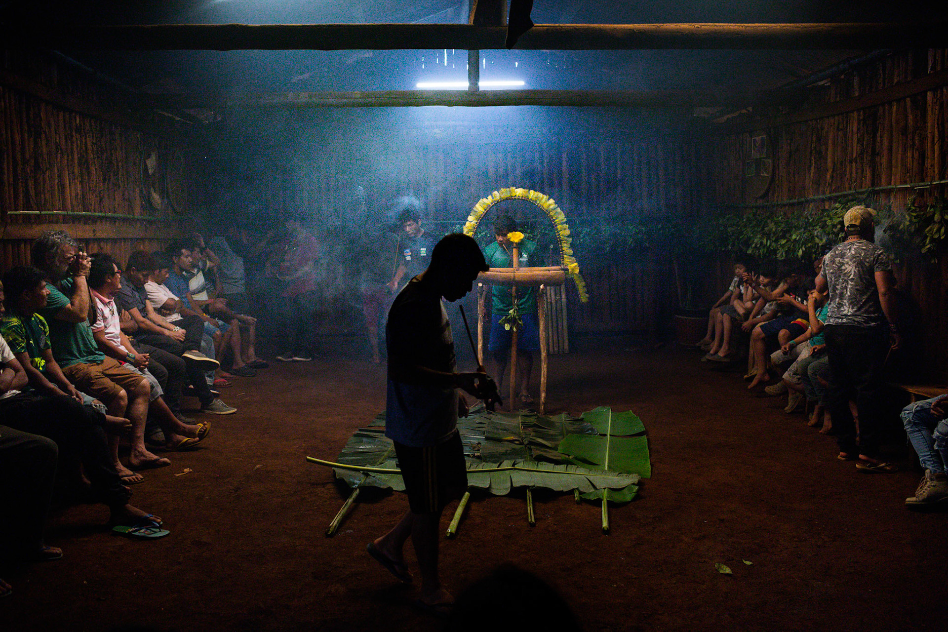 Man prays and smokes the traditional Petygua pipe during Arapyaú, the Guarani New Year. This day, which coincides with the beginning of spring, is marked by ceremonies that symbolize the renewal of spirits and nature, setting the stage for the upcoming season of new plantings.