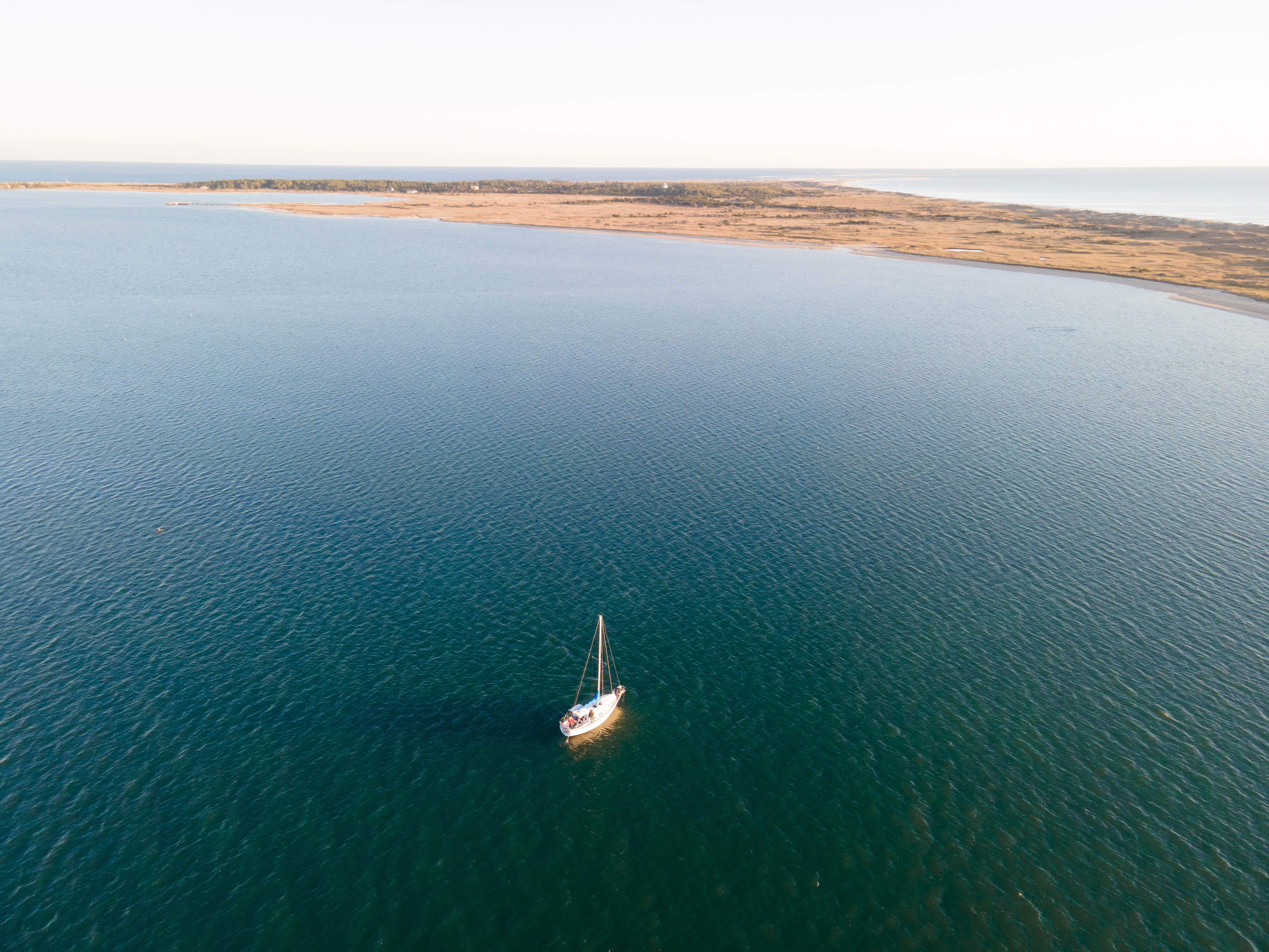 Sailboat Anchored near Cape Lookout Lighthouse