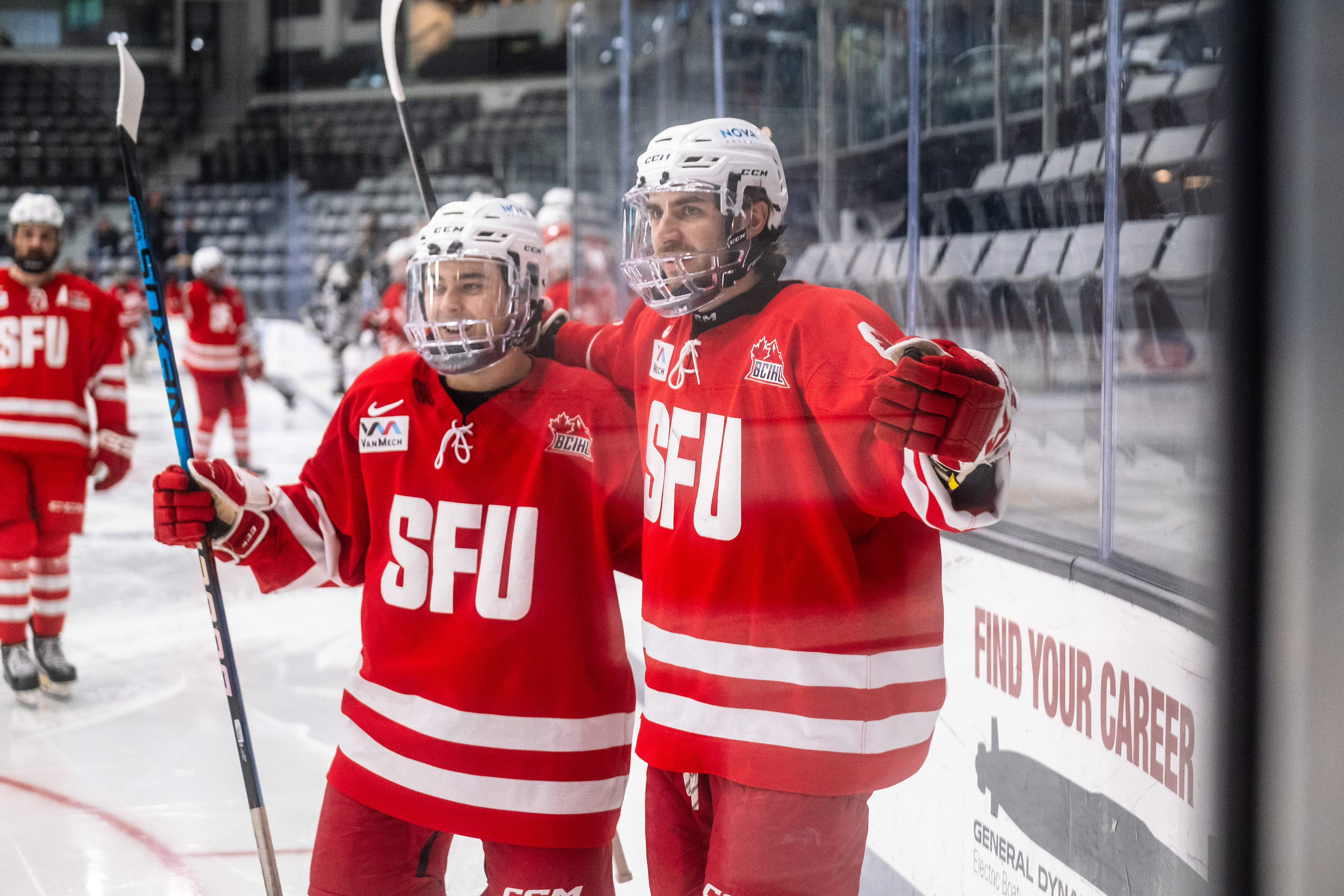 SFU at Providence 01.07.24 | Forwards Jerzy Orchard and Ben Ward celebrate a goal.