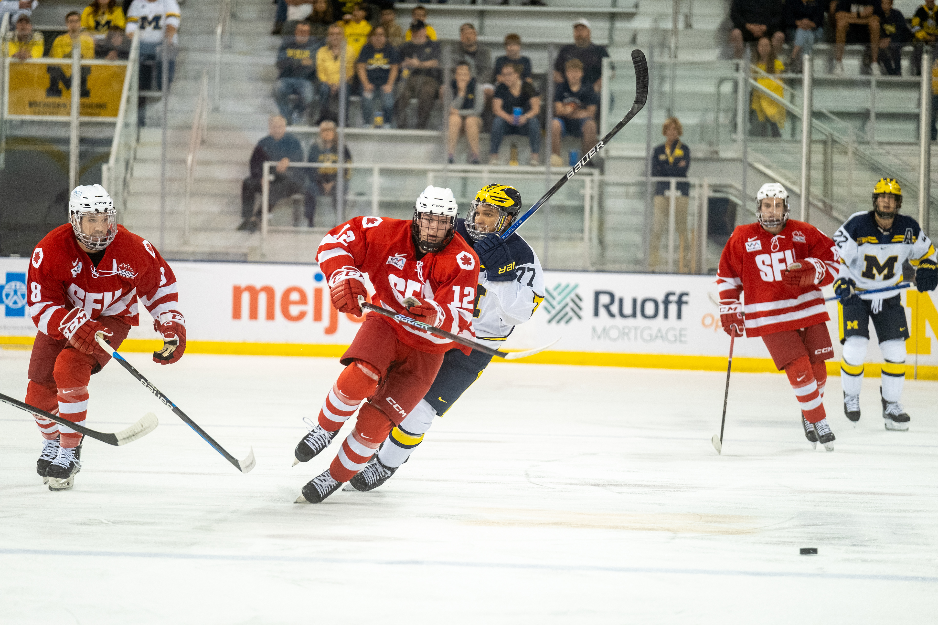 SFU at Michigan 09.30.23 | Forward Kyle Young chases down the puck in the offensive zone.