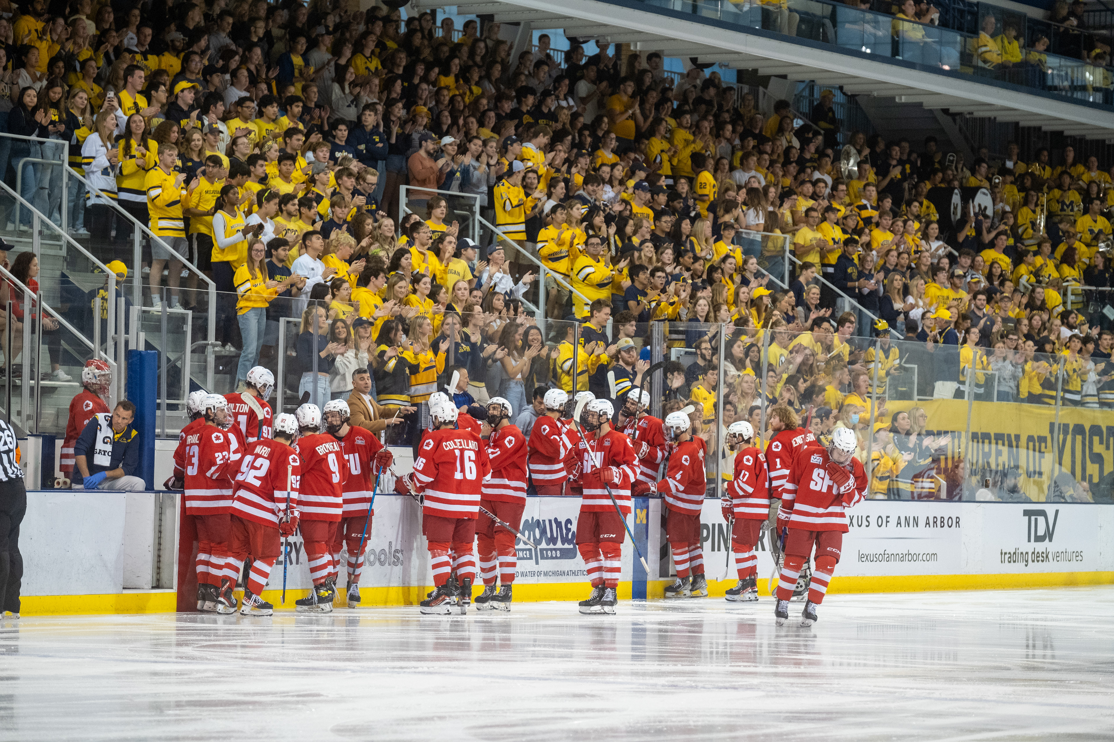 SFU at Michigan 09.30.23 | The SFU Red Leafs meet at the bench before puck drop in front of the "Children of Yost" student section.
