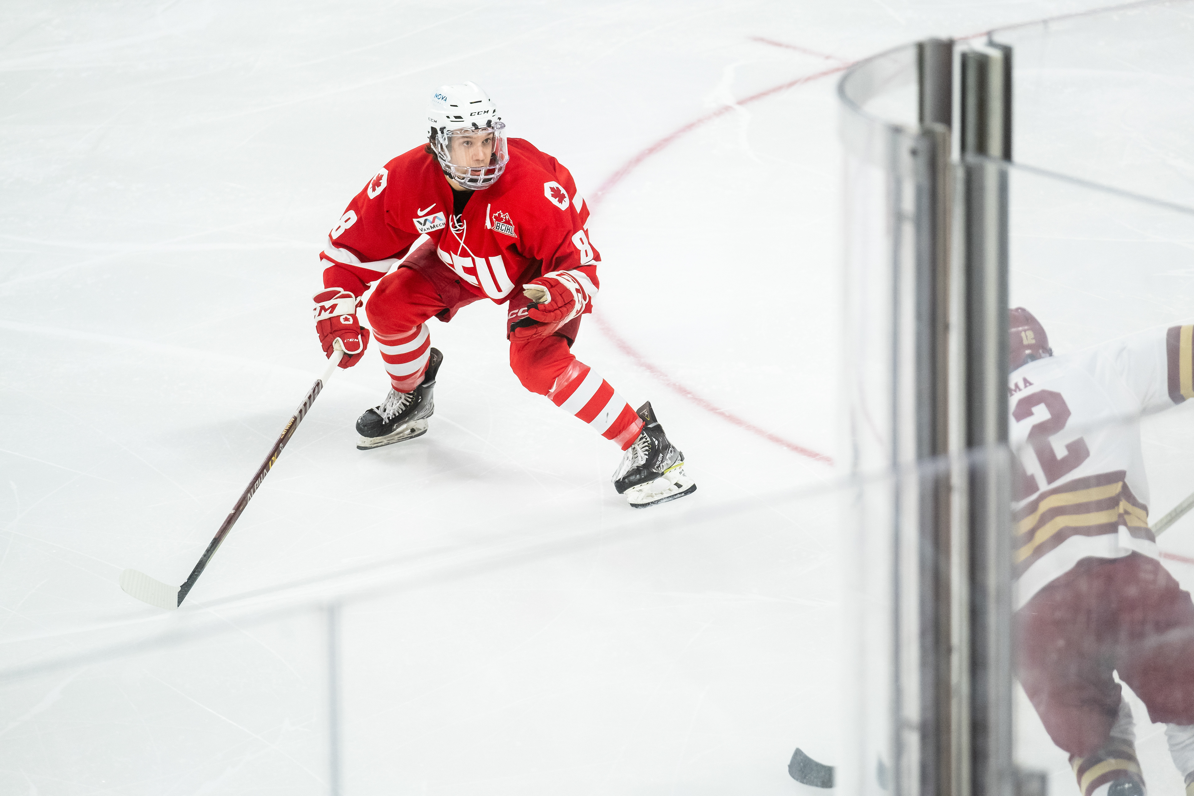 SFU at Boston College 01.06.24 | Defenceman Tristen Cross covers the attacking BC Eagle in the defensive zone.