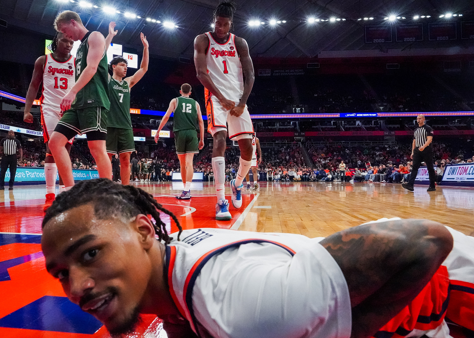 Syracuse forwards Chris Bell and Donnie Freeman celebrate into the camera after Bell's game sealing shot against LeMoyne in the JMA Wireless Dome on Monday, November 4