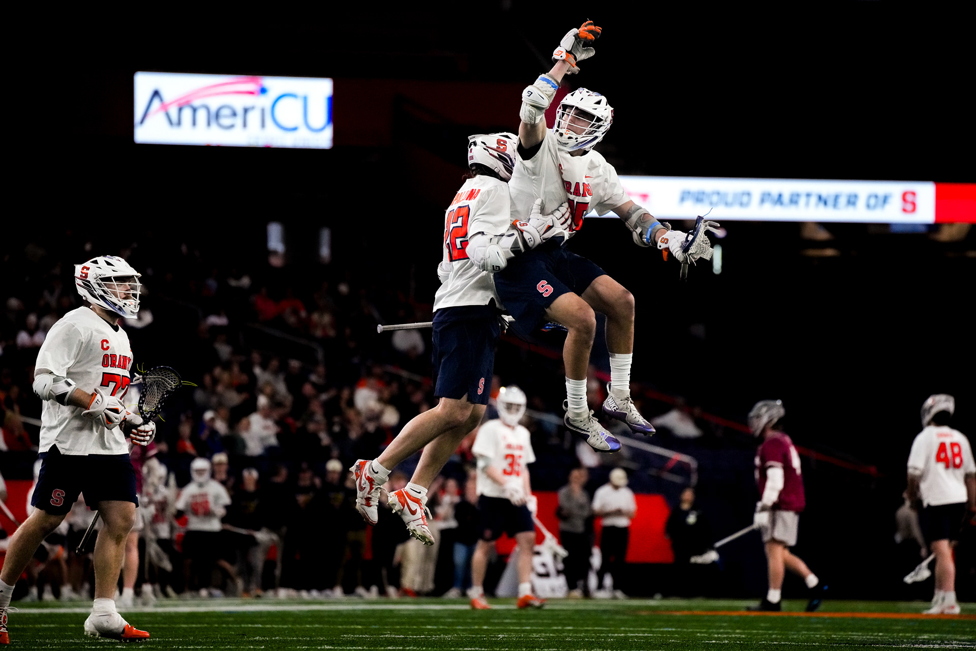 Syracuse midfielder Sam English and attacker Joey Spallina celebrate after a goal against Colgate.