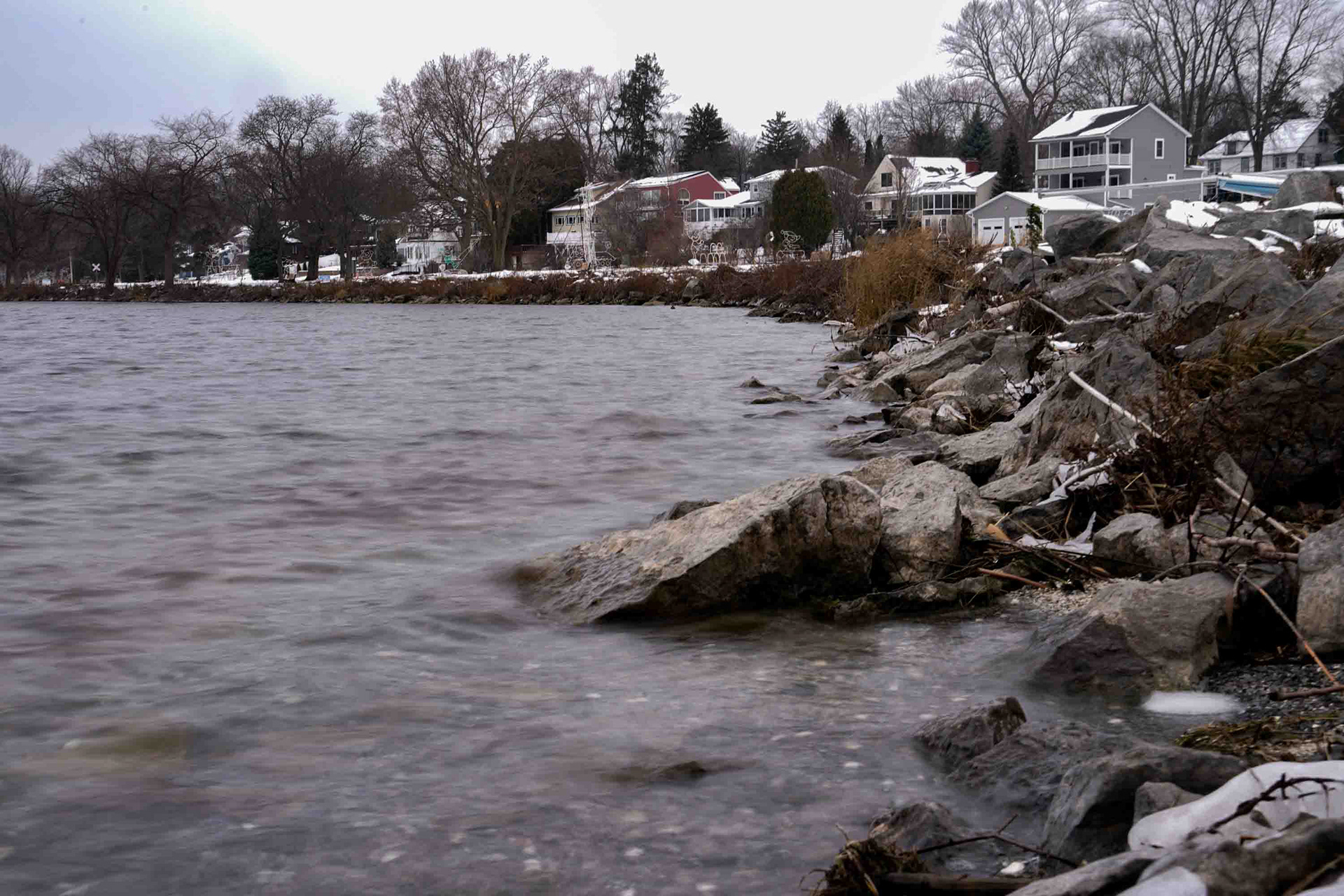 A housing development sits on the Eastern edge of Onondaga Lake Park on Sunday, December 7. In recent years residents of  Syracuse and the surrounding townships have begun moving back to Onondaga Lake, including Tim. Development projects around  the lake began in 2022, six years after the restoration was completed, starting with the multi-phase, 12 project, $108 Million  Waterfront Revitalization Master Plan. Tim says that after retirement, being by the lake was the best decision he made. Even growing  up seeing the lake’s pollution, Tim says that he has never once felt unsafe living by the lake.