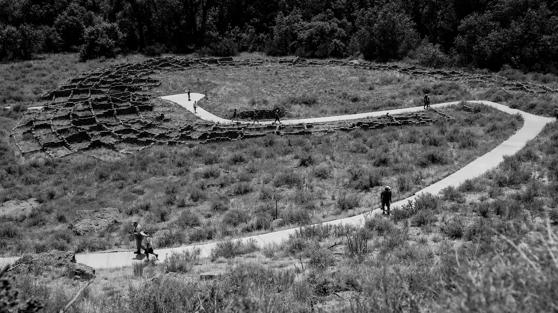 Guests hike one of the high-country trails at Rainbow Trout Ranch in southern Colorado. The steep terrain and shifting weather make the land a central part of daily life at the ranch.