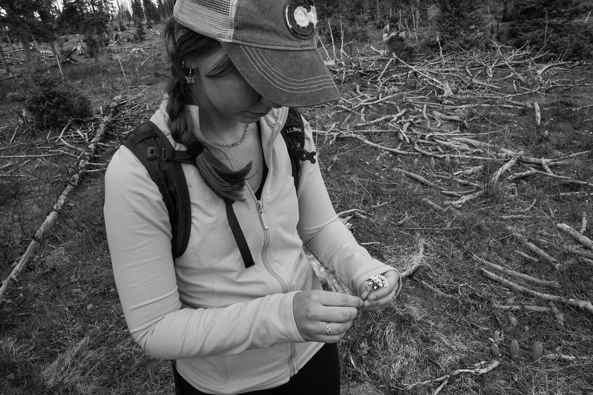 Housekeeper and hiking guide Lucy Saunders identifies native mountain flowers while leading guests to a nearby waterfall. Wildflowers go through significant changes through the seasons at high altitude, and identifying them is telling about the weather conditions and changing landscape.
