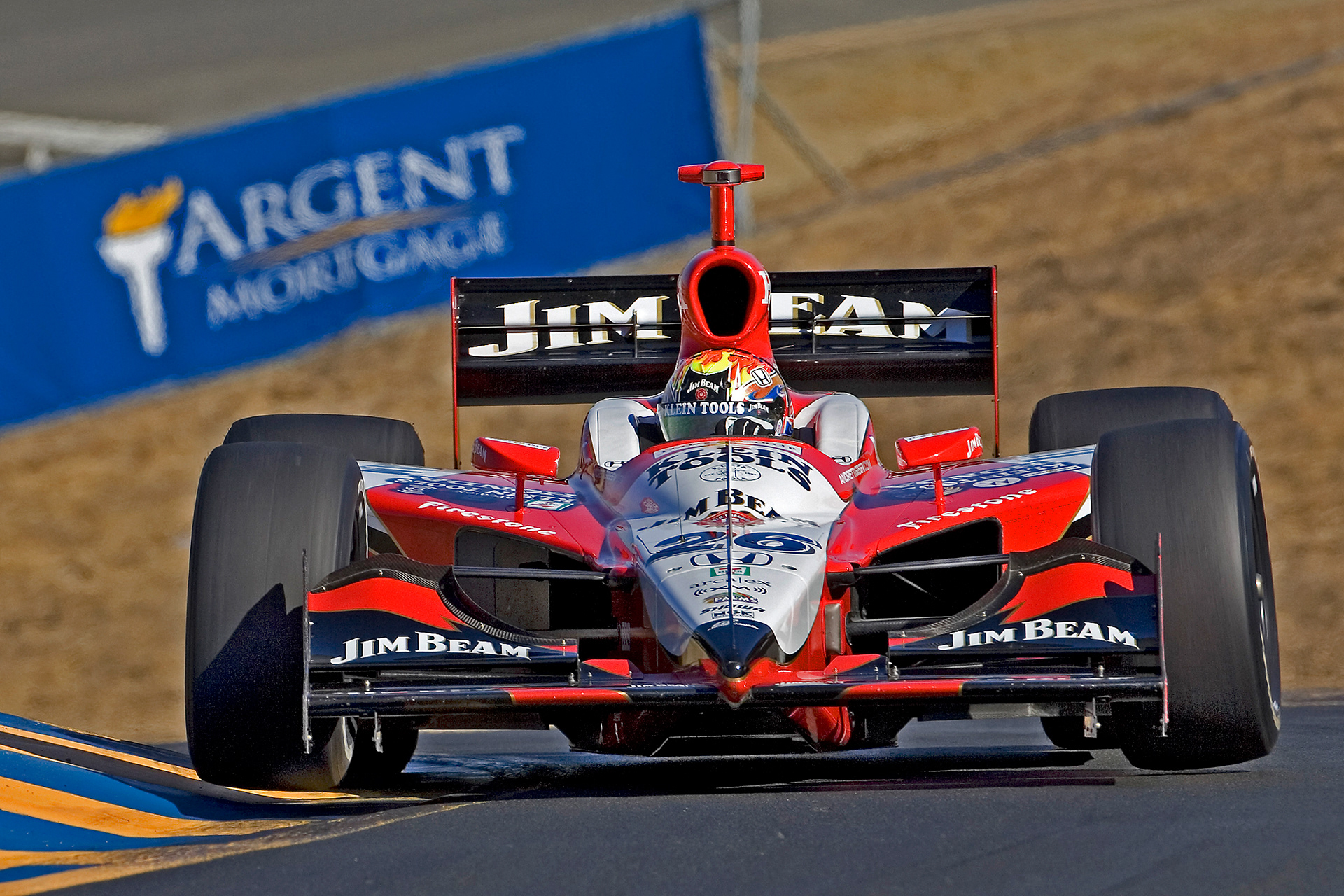 2005 Indy 500 winner Dan Wheldon in the Jim Beam Indy Car gets both front wheels off the track.  ©  IAN DONALD
