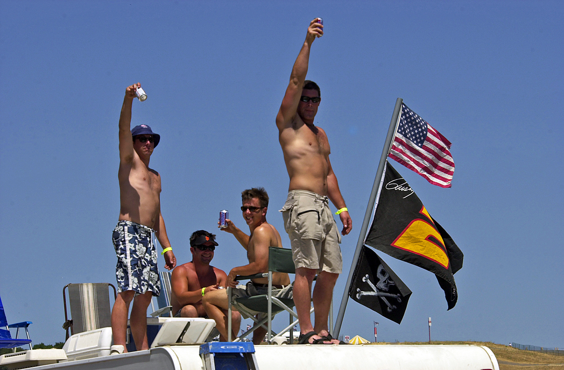 Boisterous NASCAR fans having fun on the roof of their RV...  ©  IAN DONALD