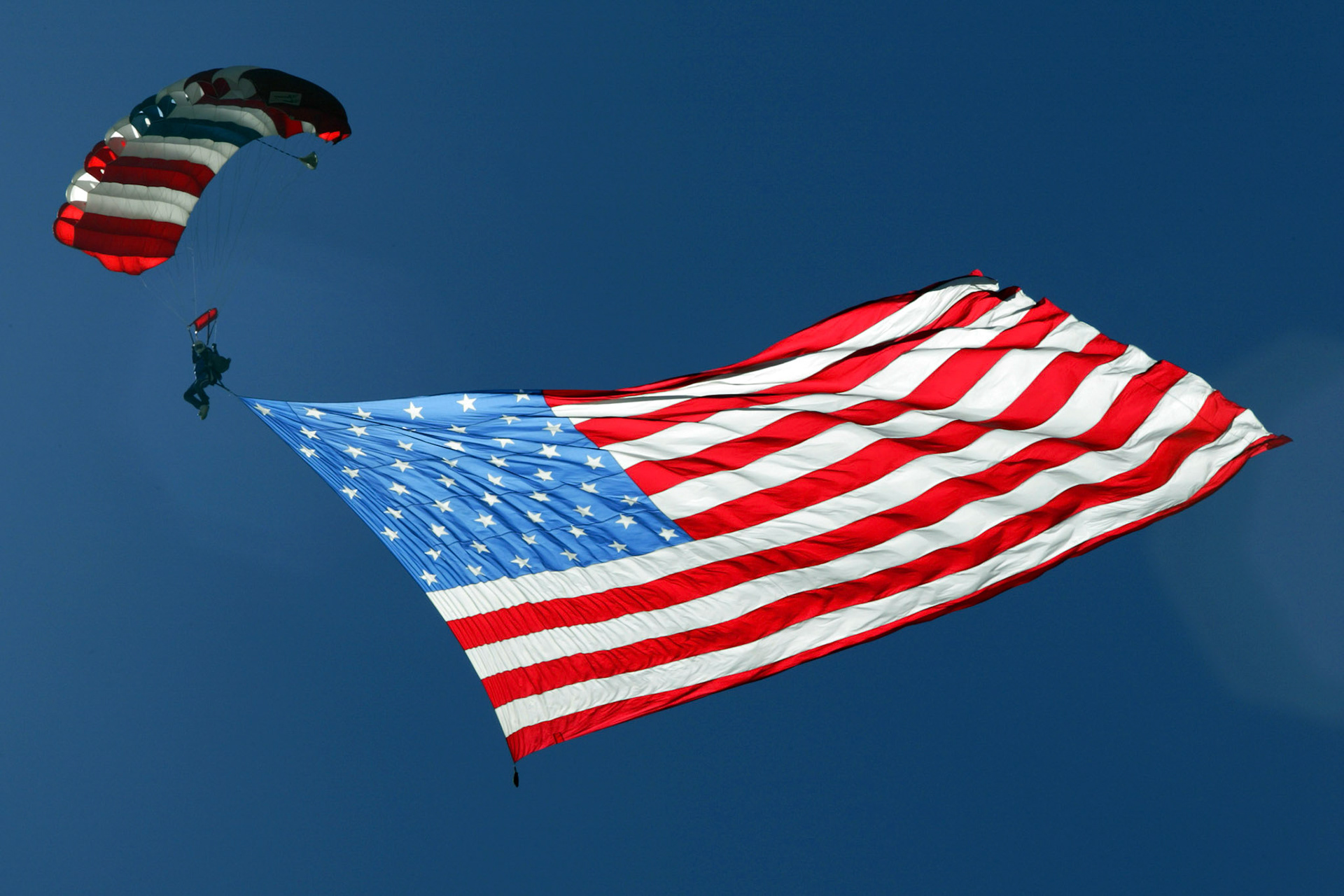 The Army parachute team showing the flag at NASCAR.     © IAN DONALD