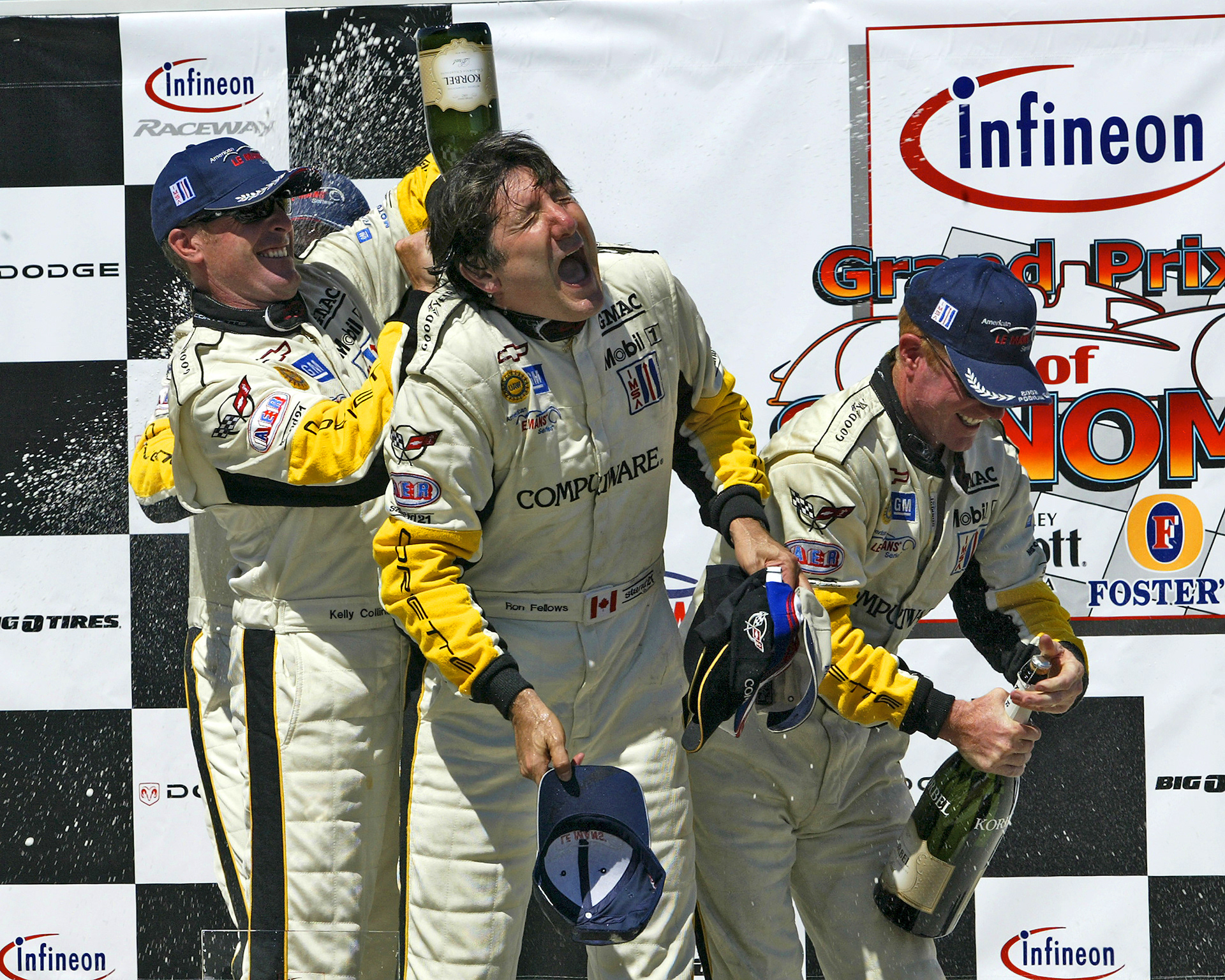 Johnny O'Connell and Ron Fellows wasting perfectly good Champagne...  © IAN DONALD