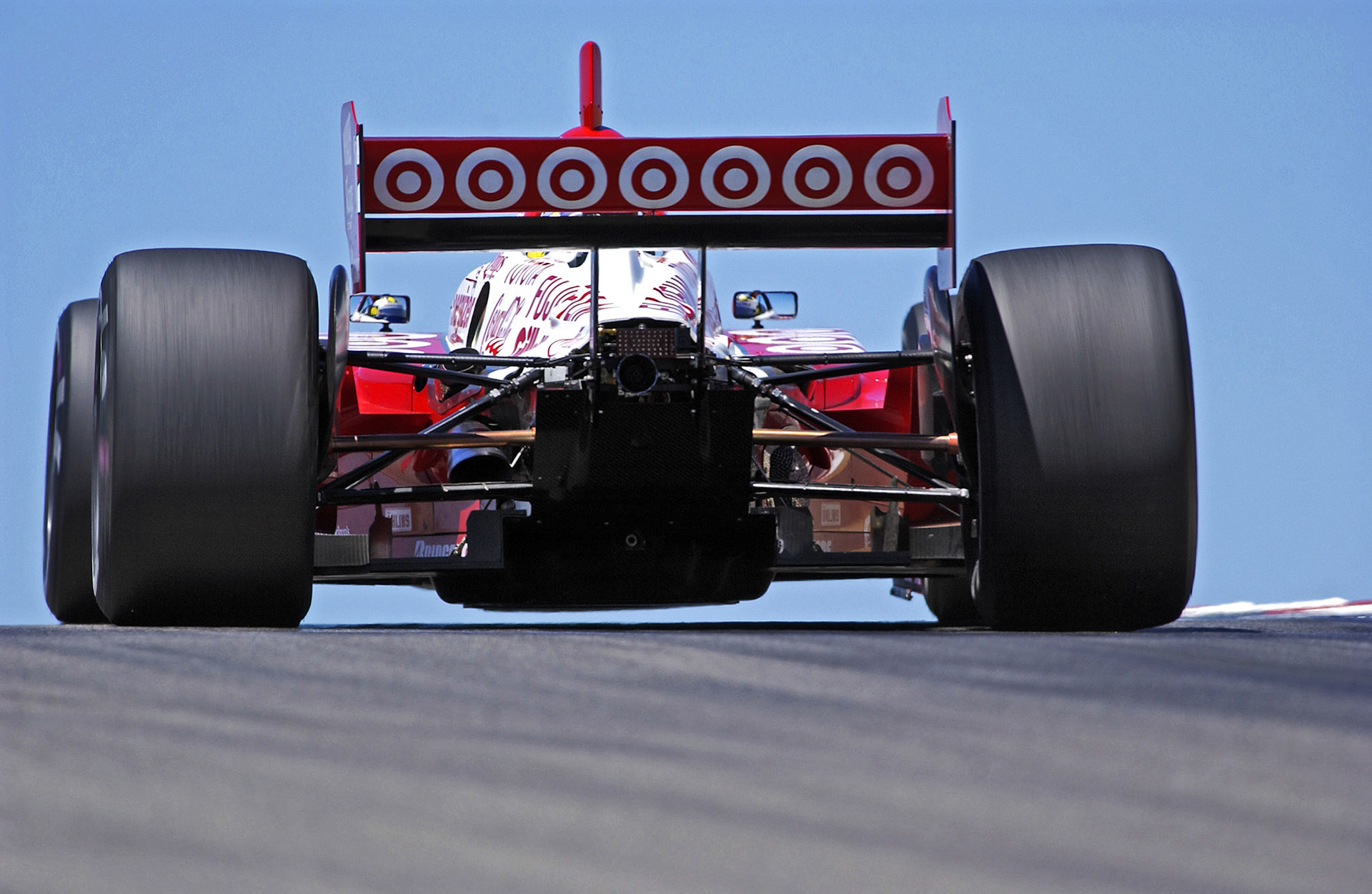 A Target Indy Car crests the top of the hill before Turn 7 at Laguna ©  IAN DONALD