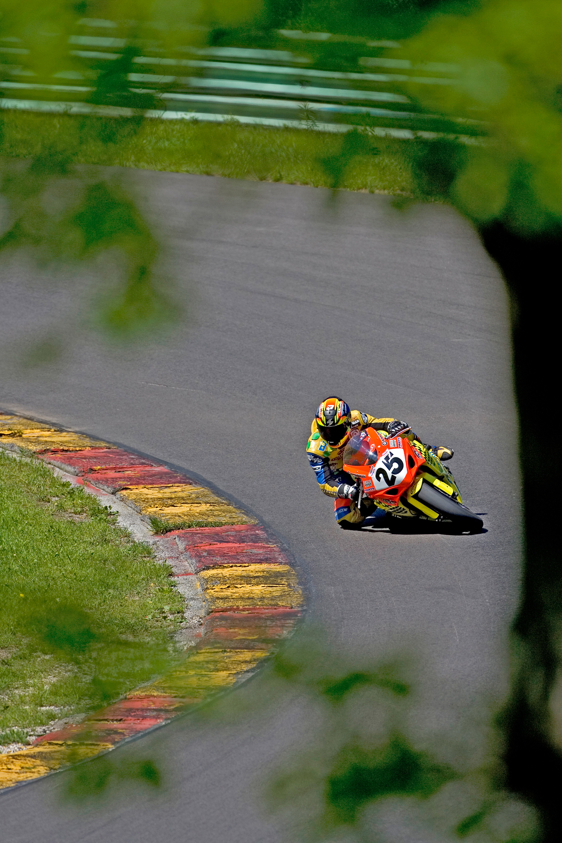 A Superbike - seen through the trees above Canada Corner, Road America, WI.  © IAN DONALD