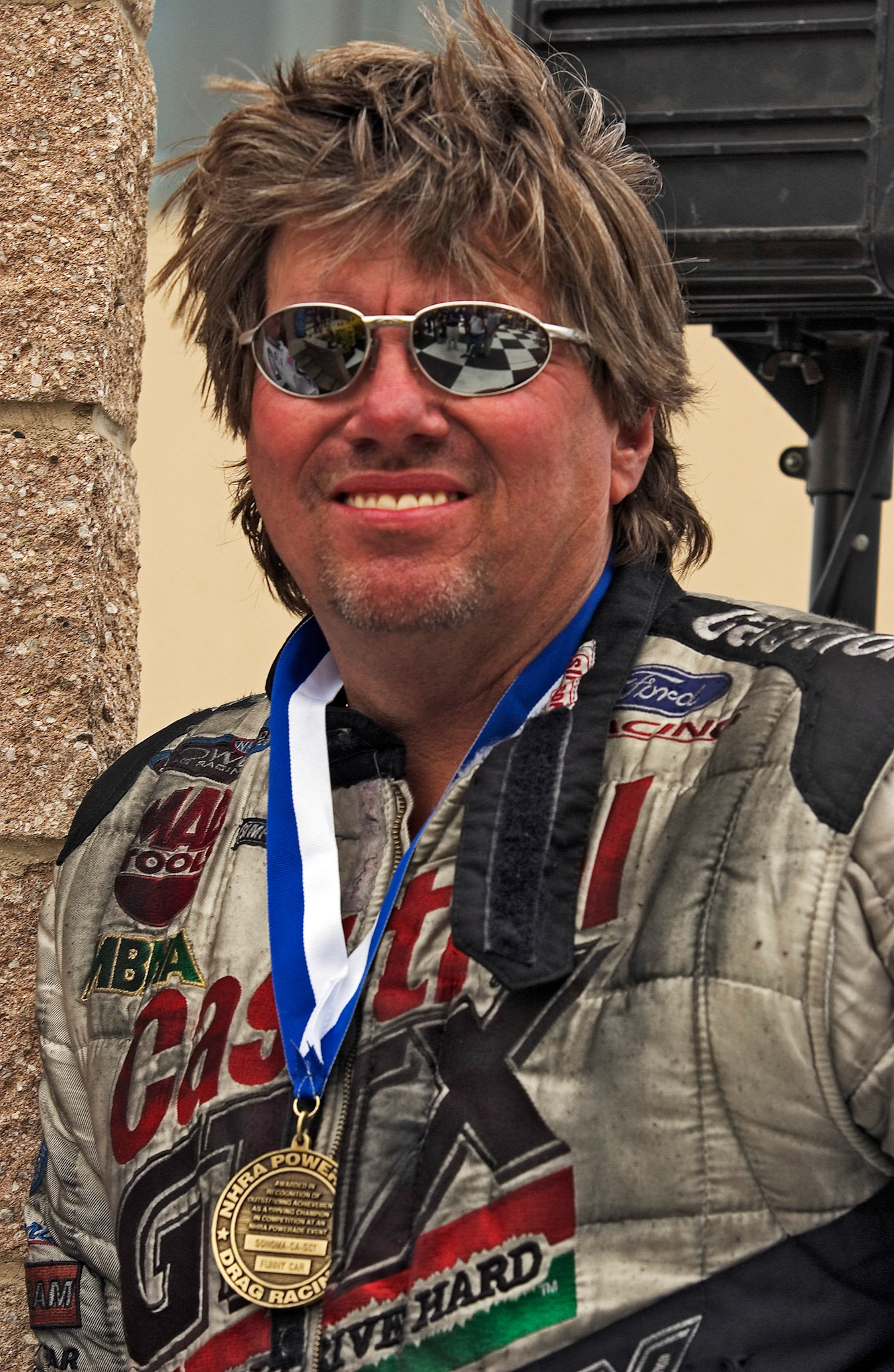 John Force gets dirty in his line of work...  ©  IAN DONALD