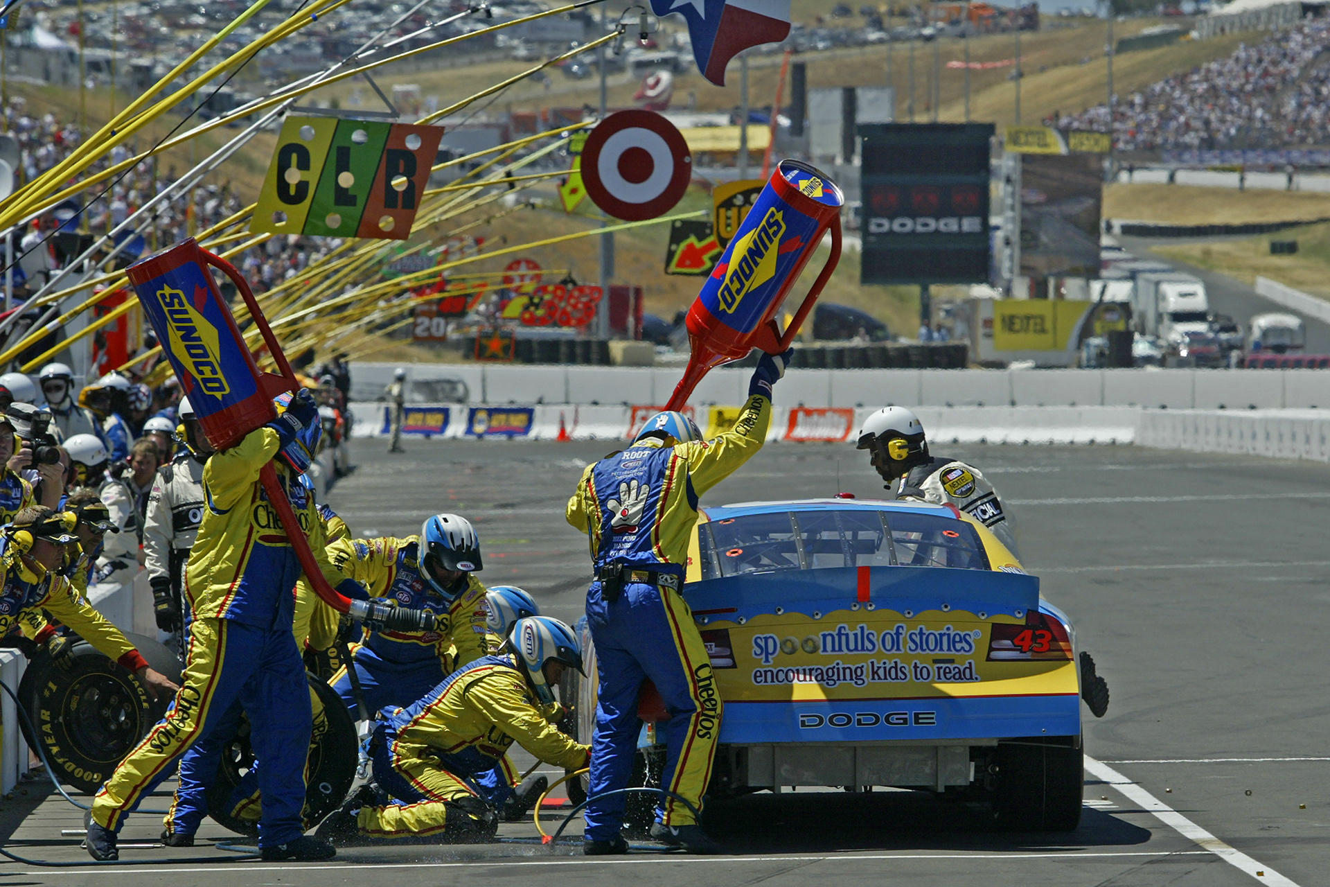 The "Fuel Can Ballet" during a NASCAR Pit stop - at the time I shot this image NASCAR allowed 6 members of the Pit Crew over the wall at any one time. To avoid chaos - every move needed to be choreographed...  ©  IAN DONALD