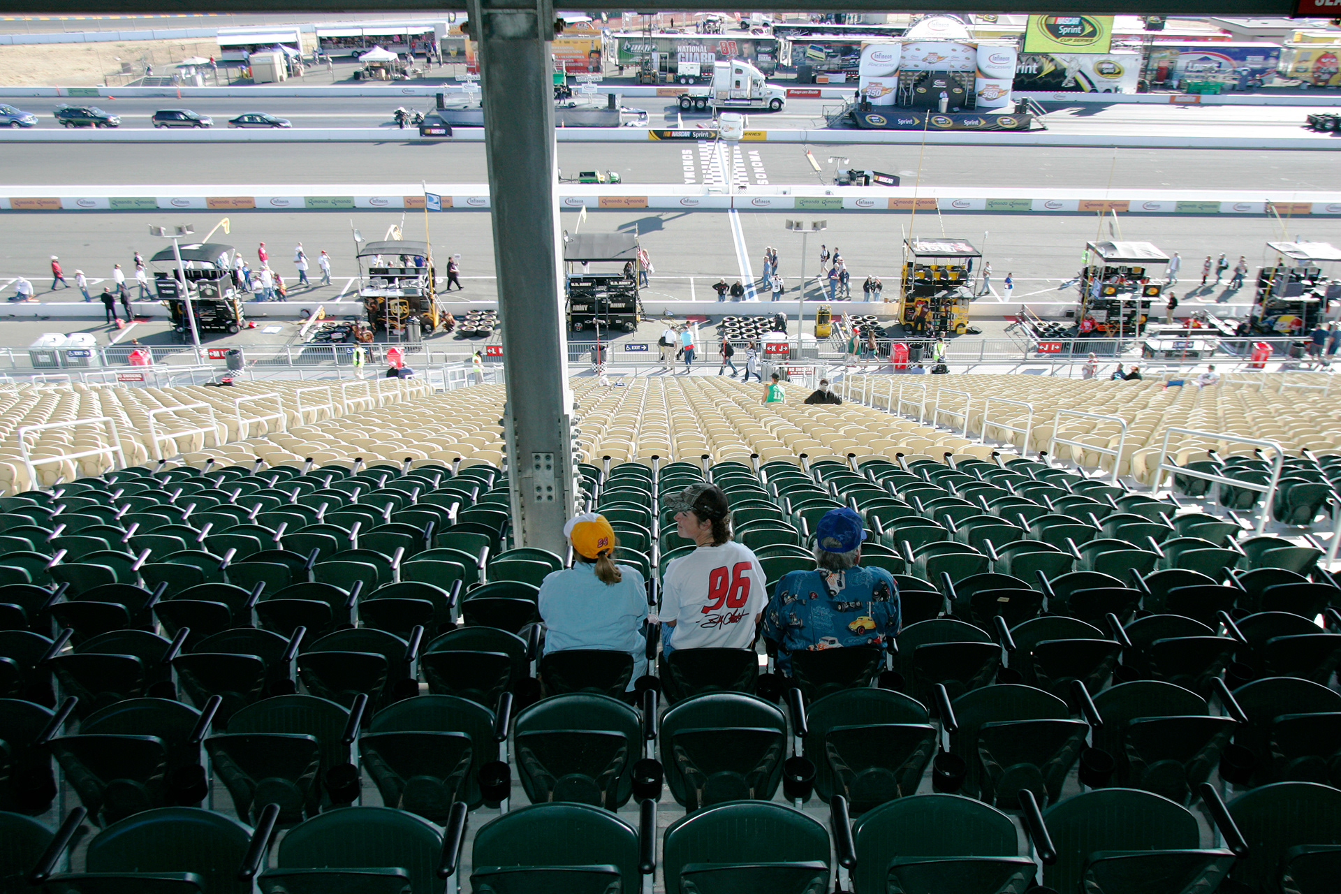 Early birds - waiting for the NASCAR event crowd to arrive in the main Grandstand at Sonoma...  © IAN DONALD