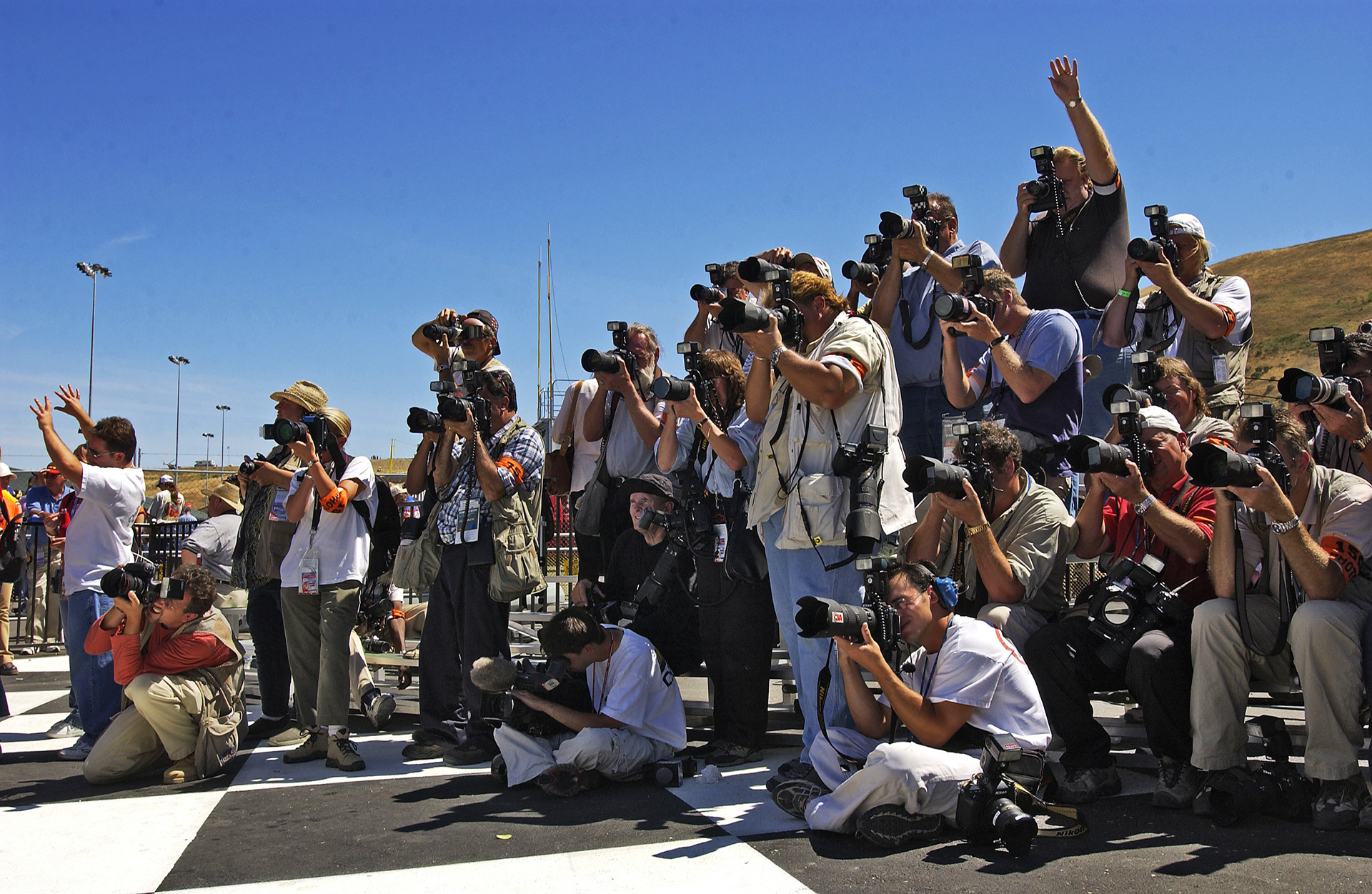 Got to keep the Sponsors happy - photographers shooting "The Hat Dance" in Winners Circle...  ©IAN DONALD