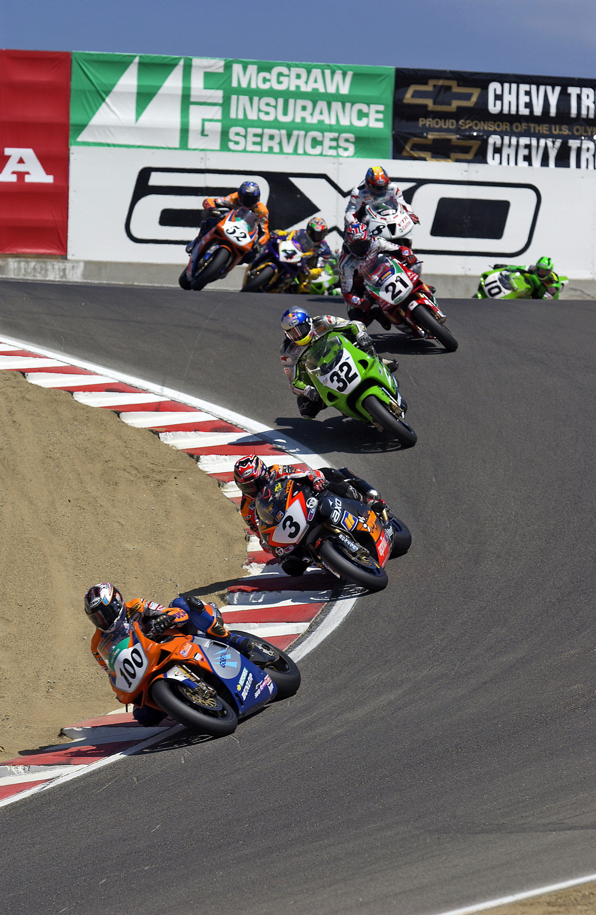 Neil Hodgson leads Troy Corser, Eric Bostrom and Troy Bayliss down "The Corkscrew".  ©  IAN DONALD