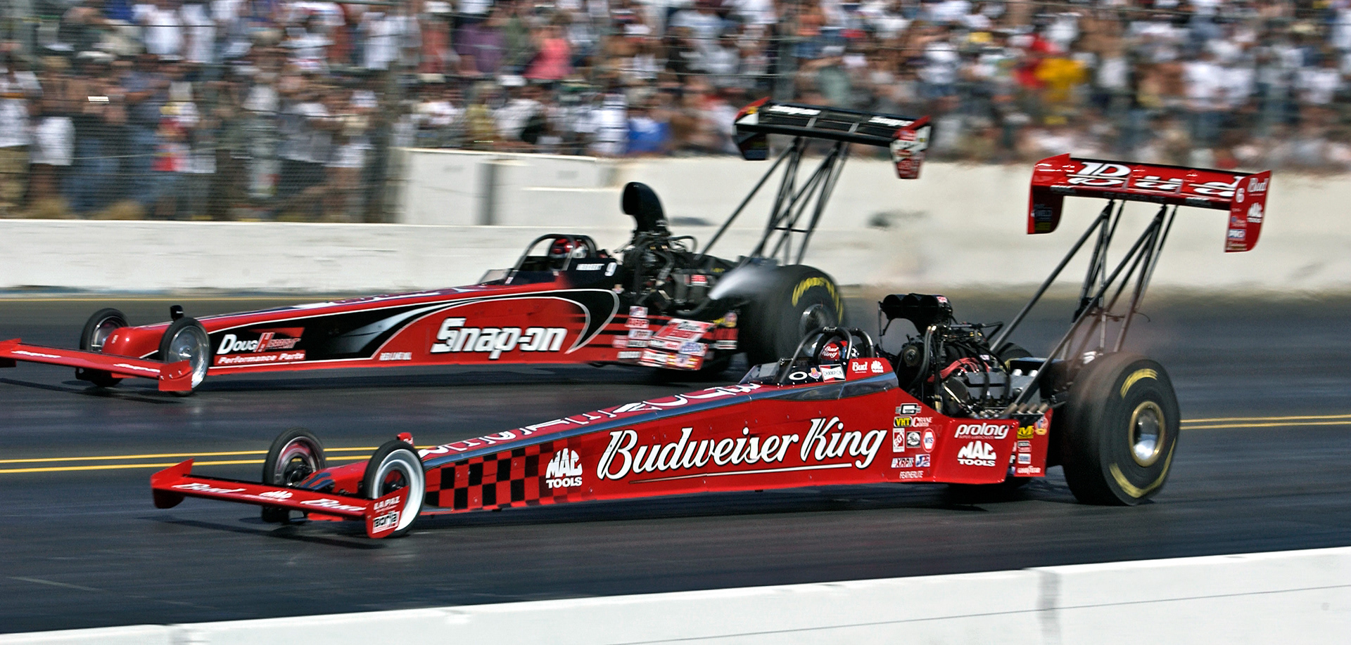 Kenny Bernstein in the "Budweiser King" leads Doug Herbert in the "Snap-On" Top Fuel car in a shootout at Sonoma © IAN DONALD
