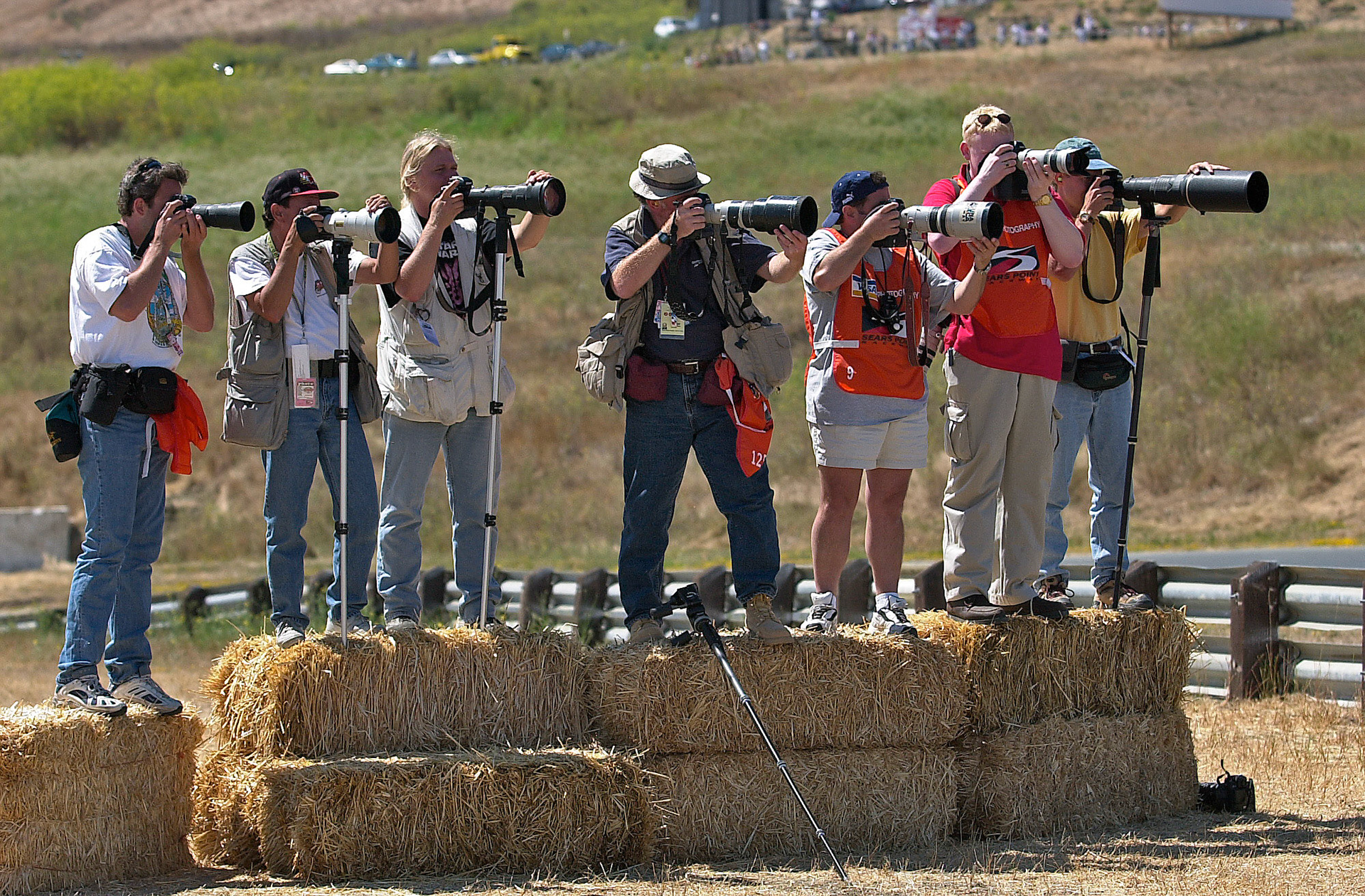 Motorsports photography is an over-populated business - here are a line of Track Photographers - all trying to get a unique shot from the same position...  ©  IAN DONALD