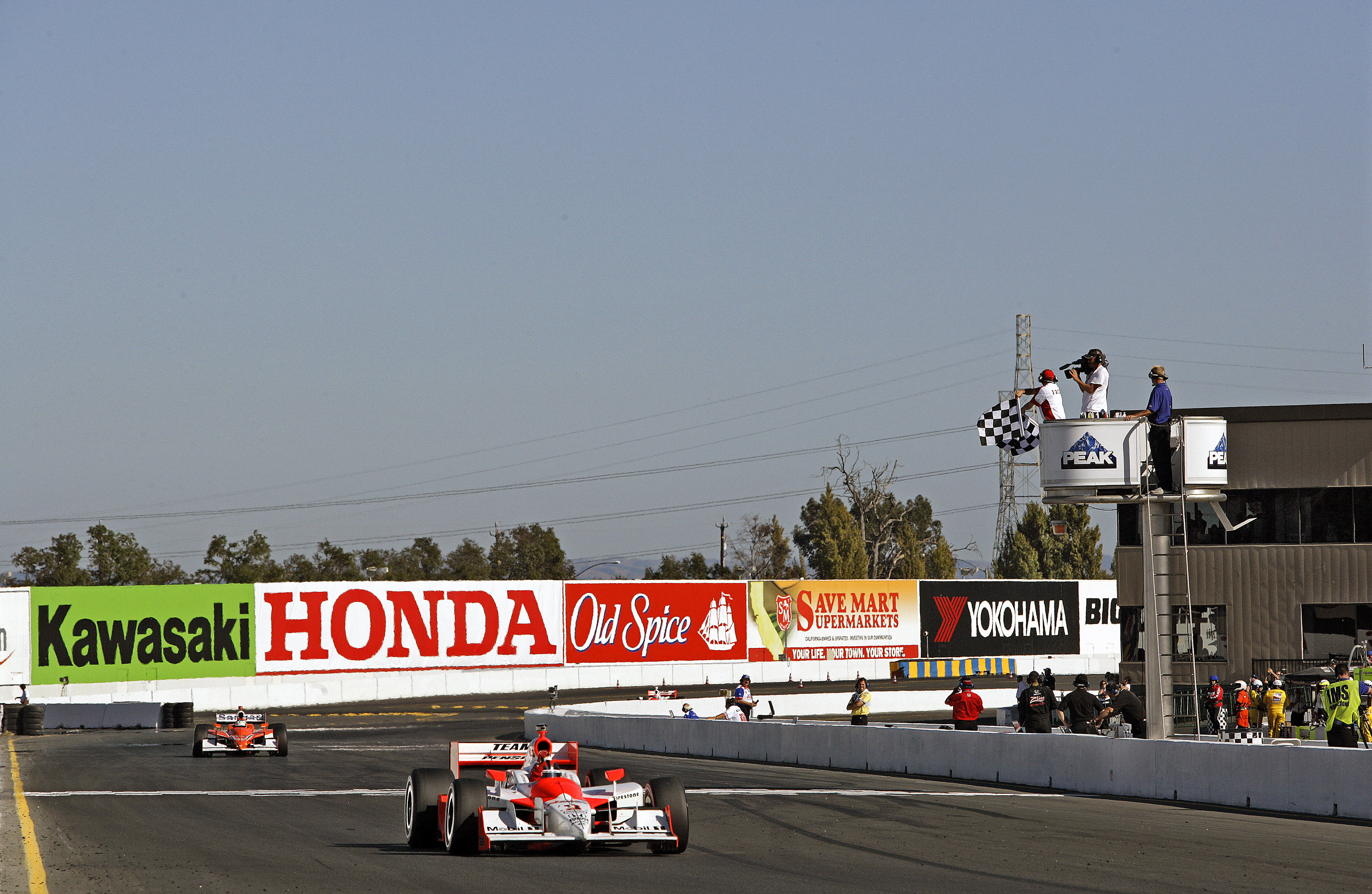 Winner - Helio Castroneves - crosses the Finish Line.  ©  IAN DONALD