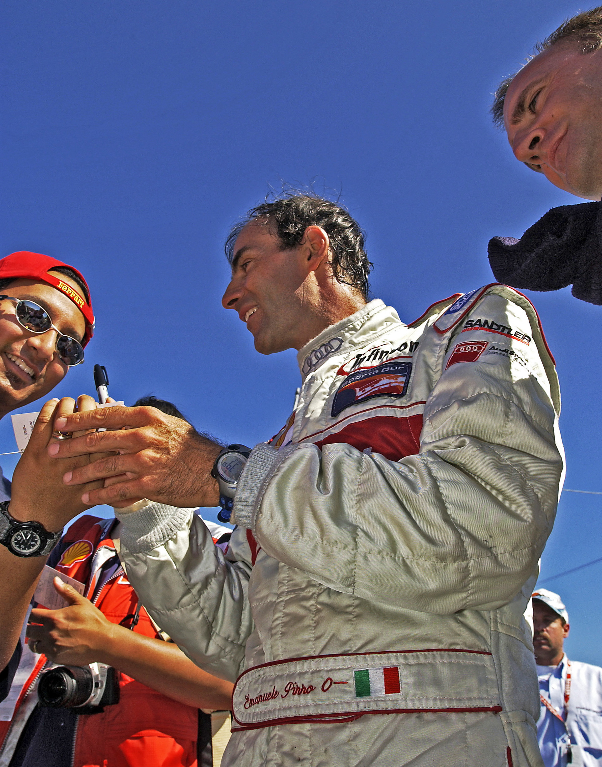 Audi driver - Emanuele Pirro - signs autographs after a win © IAN DONALD