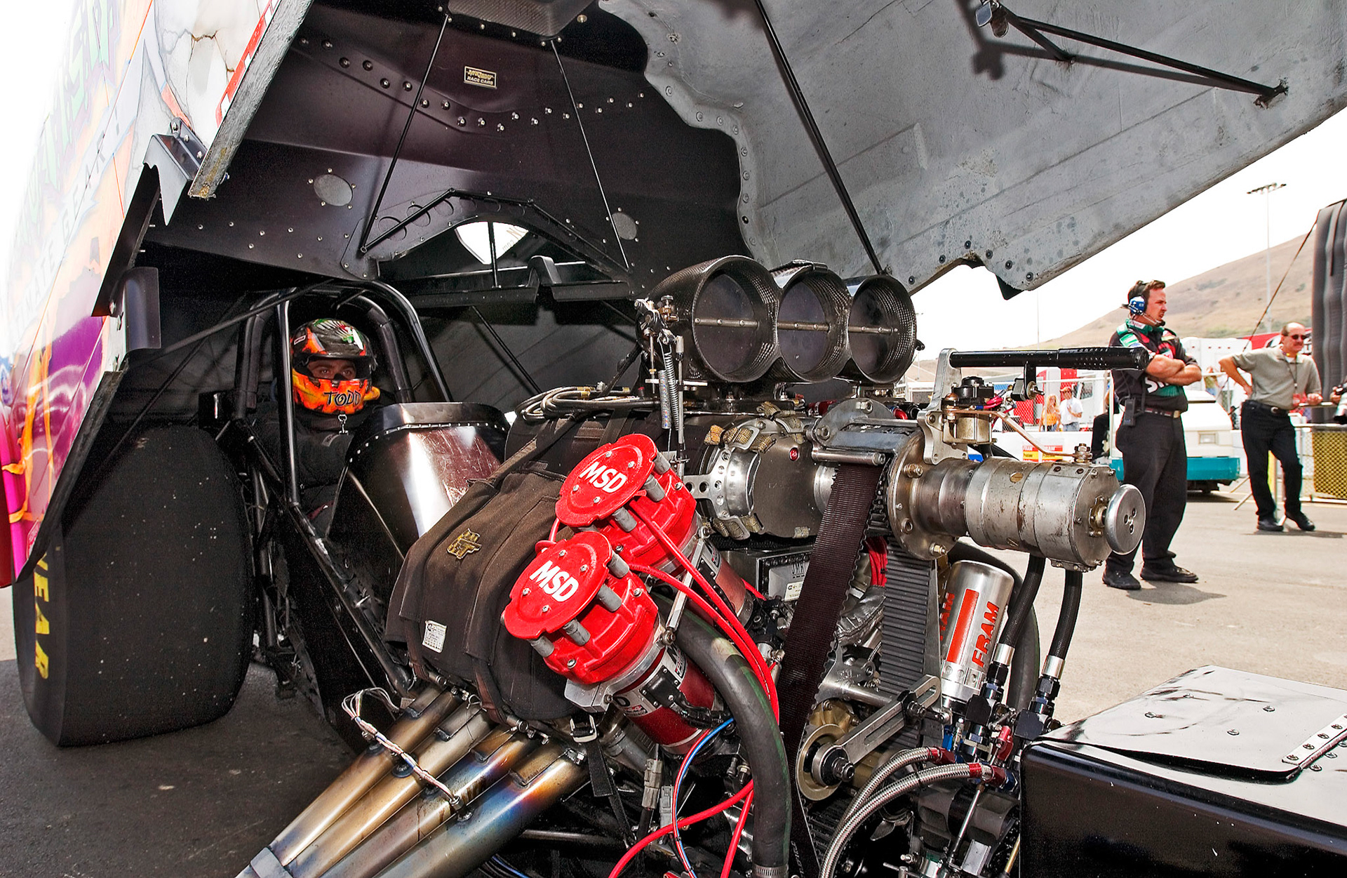Kevlar shields strapped over Funny Car engines are there for WHEN - not IF it blows...©  IAN DONALD