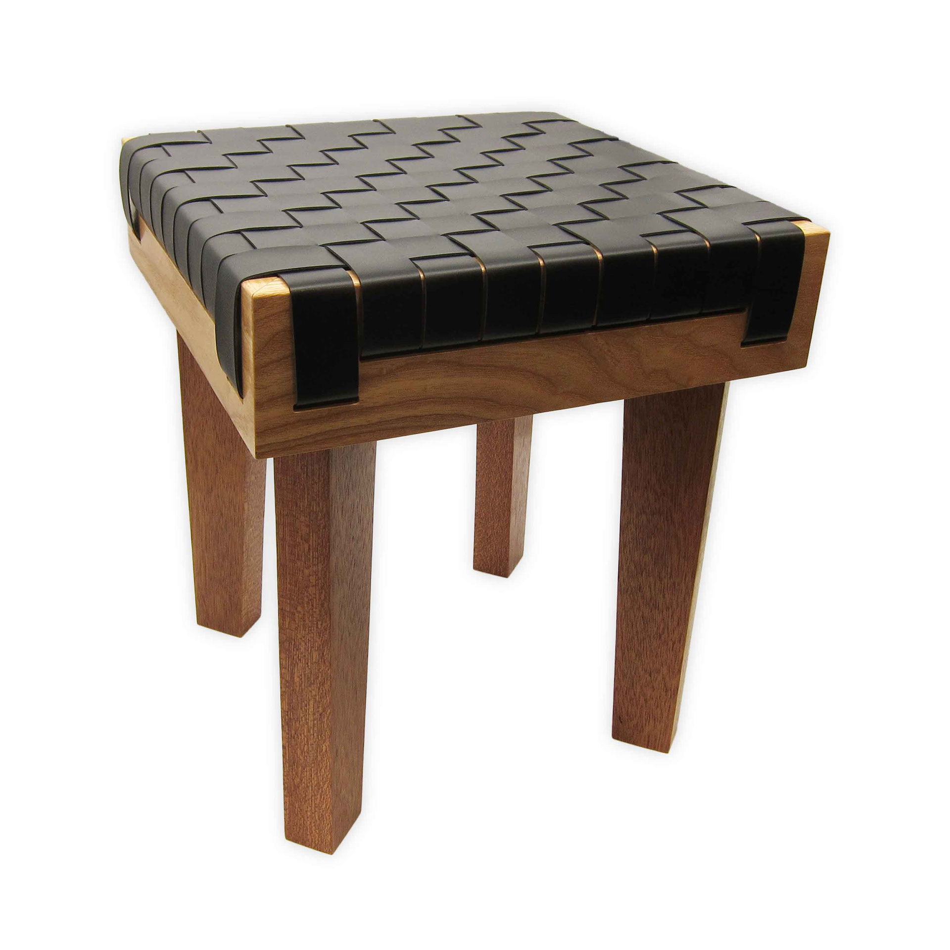 Unique four legged stool made with multiple hardwoods and a woven seat made from black cactus leather on a white background