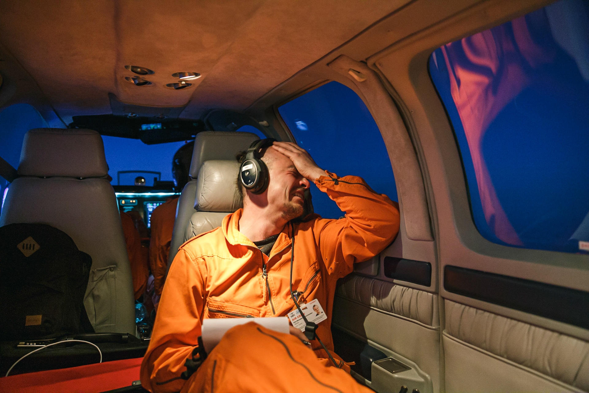During the flight back to Lampedusa the tactical coordinator of the aircrew bursts into tears after receiving the information that the boat in distress has finally been found and rescued by the rescue assets of Open Arms.