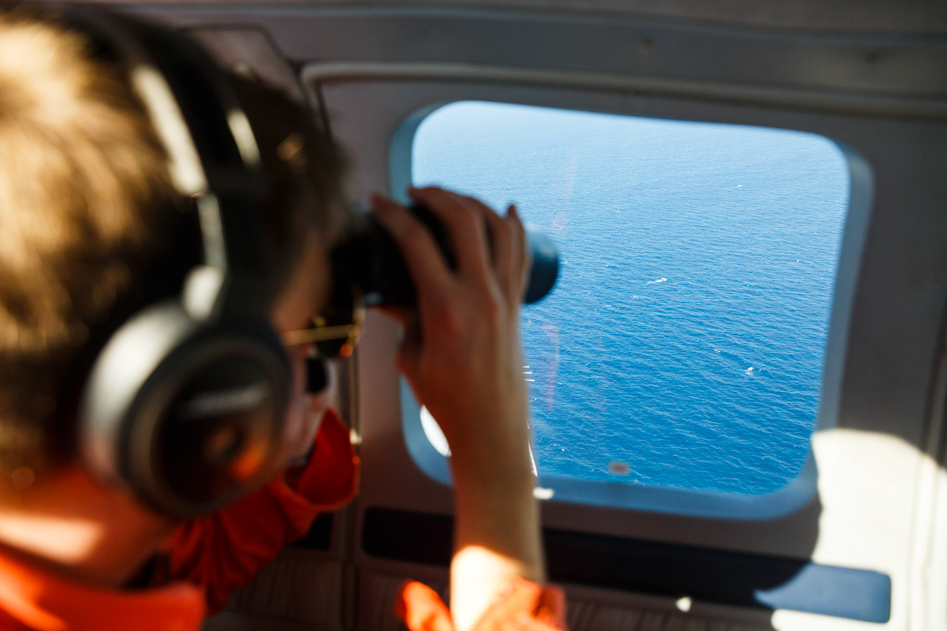 During the monitoring mission the crew members use binoculars to identify objects in the water. Spotting can get very difficult when there is haze in the air. Also in rough seas the whitecaps of breaking waves can easily be confused with potential targets. In case of doubt the aircraft will descend and get closer to clarify the nature of a potential target.