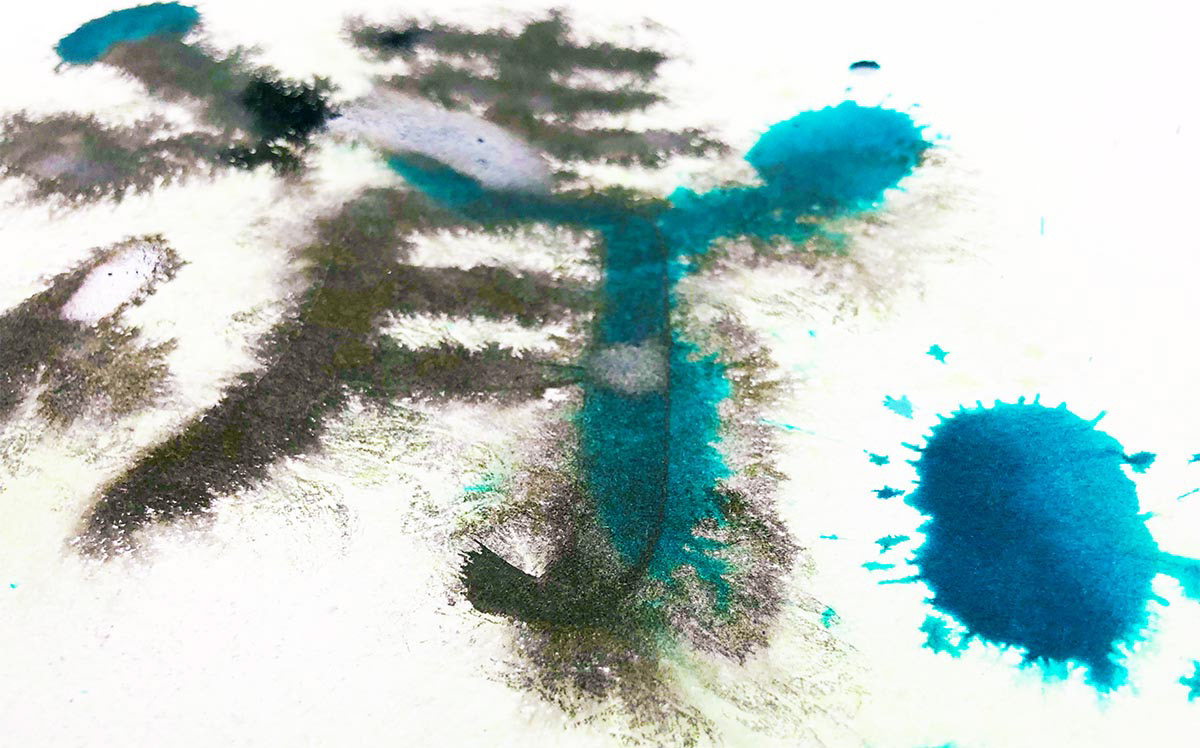 Sumi calligraphy ink and methylene blue dye on paper.