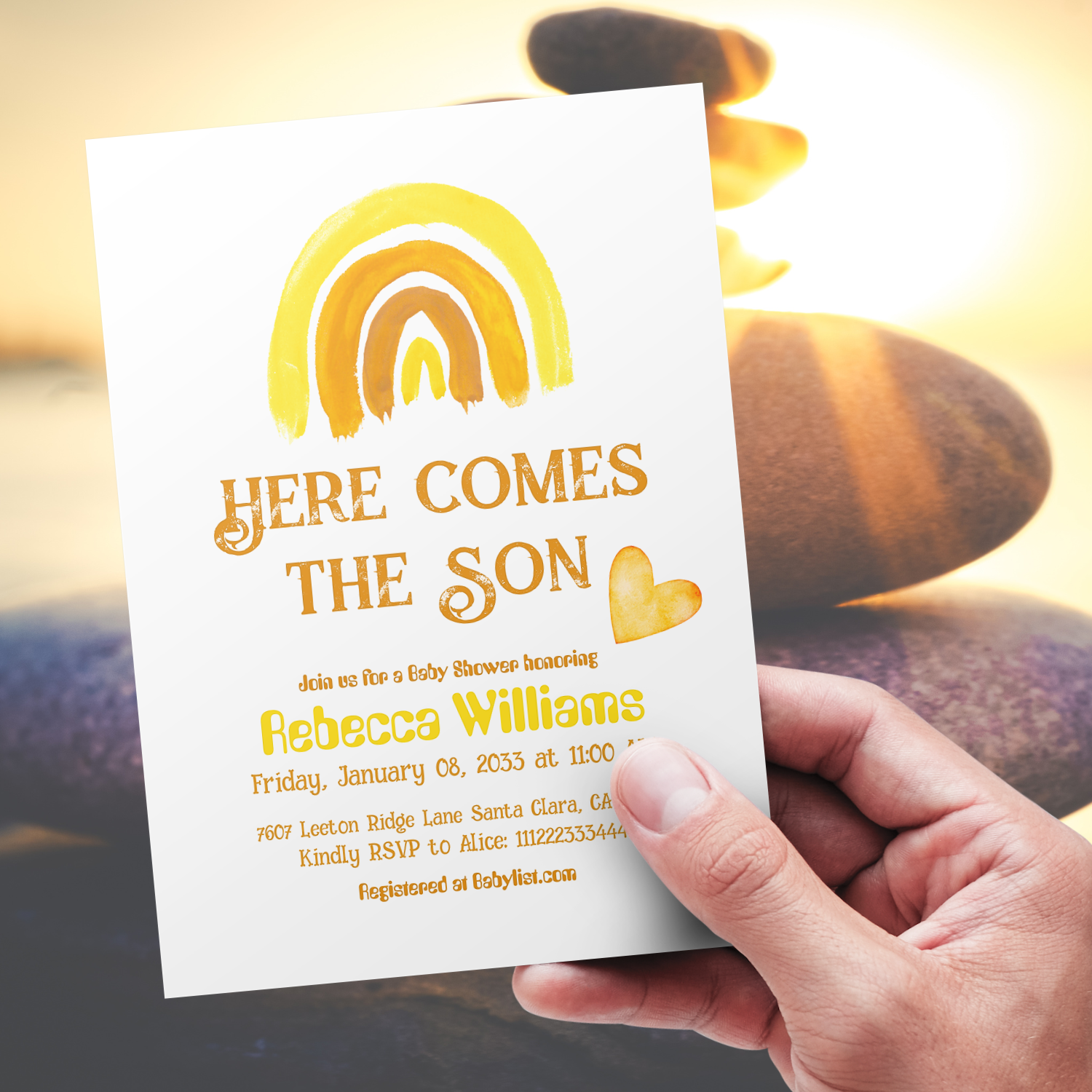Watercolor painted boho rainbow and heart in Sunshine yellow, orange colors themed baby shower invitation with text " here comes the son"  hold in right hand and sun ray and stones on the background