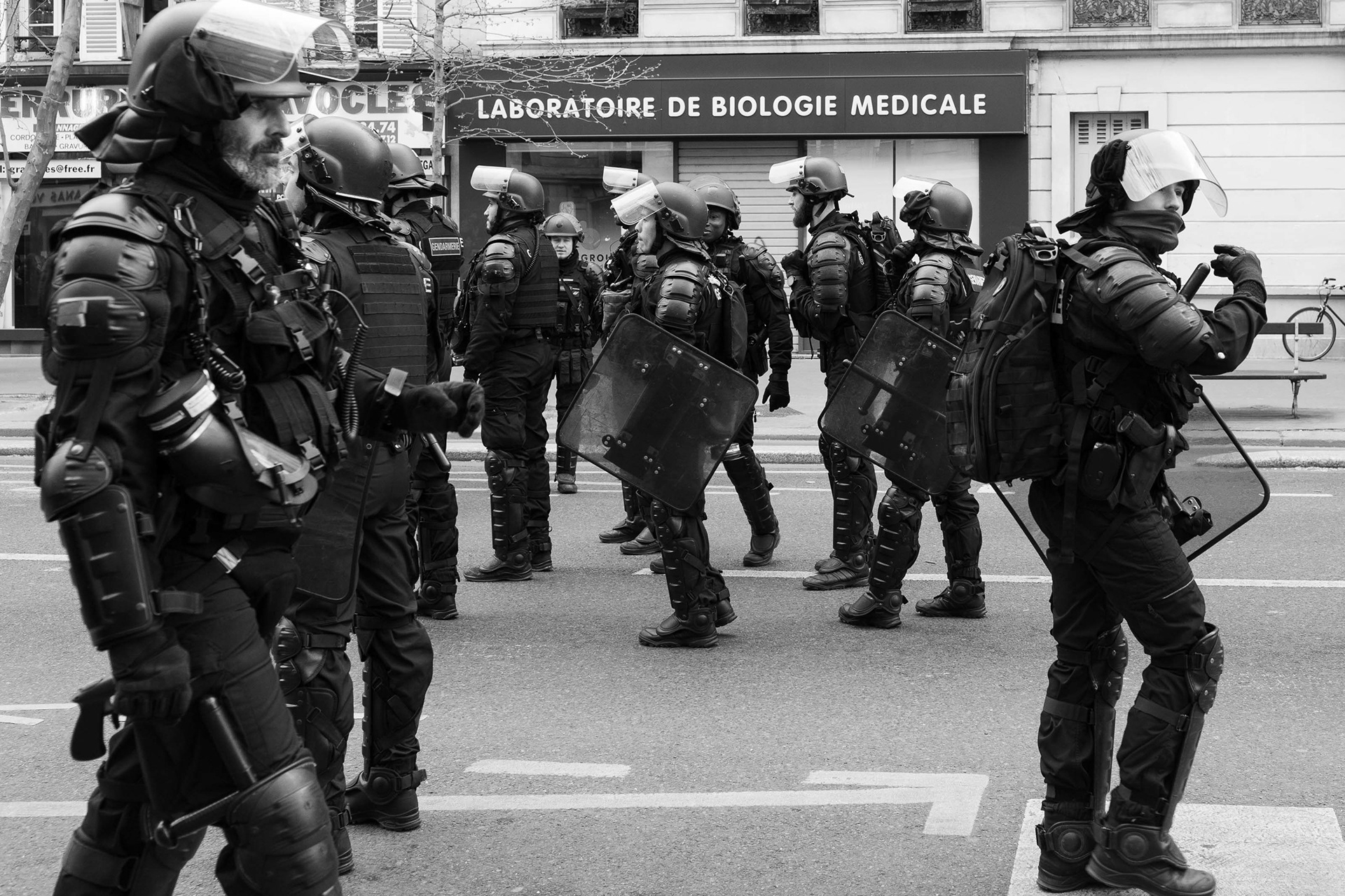 Policemen walking at pension reform protest, March 2023,Paris