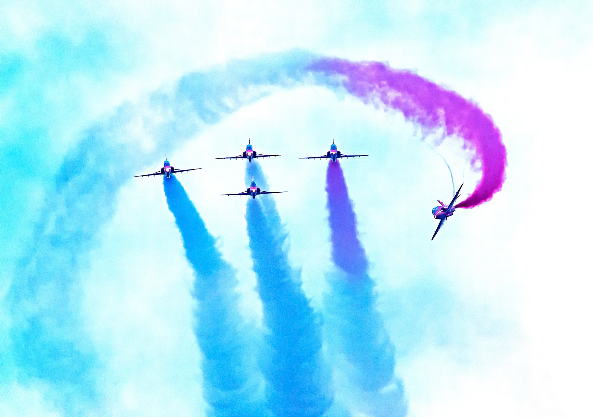 The Red Arrows, officially known as the Royal Air Force Aerobatic Team, is the aerobatics display team of the Royal Air Force based at RAF Scampton. The team was formed in late 1964 as an all-RAF team, replacing a number of unofficial teams that had been sponsored by RAF commands.The Red Arrows badge shows the aircraft in their trademark diamond nine formation, with the motto Éclat, a French word meaning "brilliance" or "excellence".