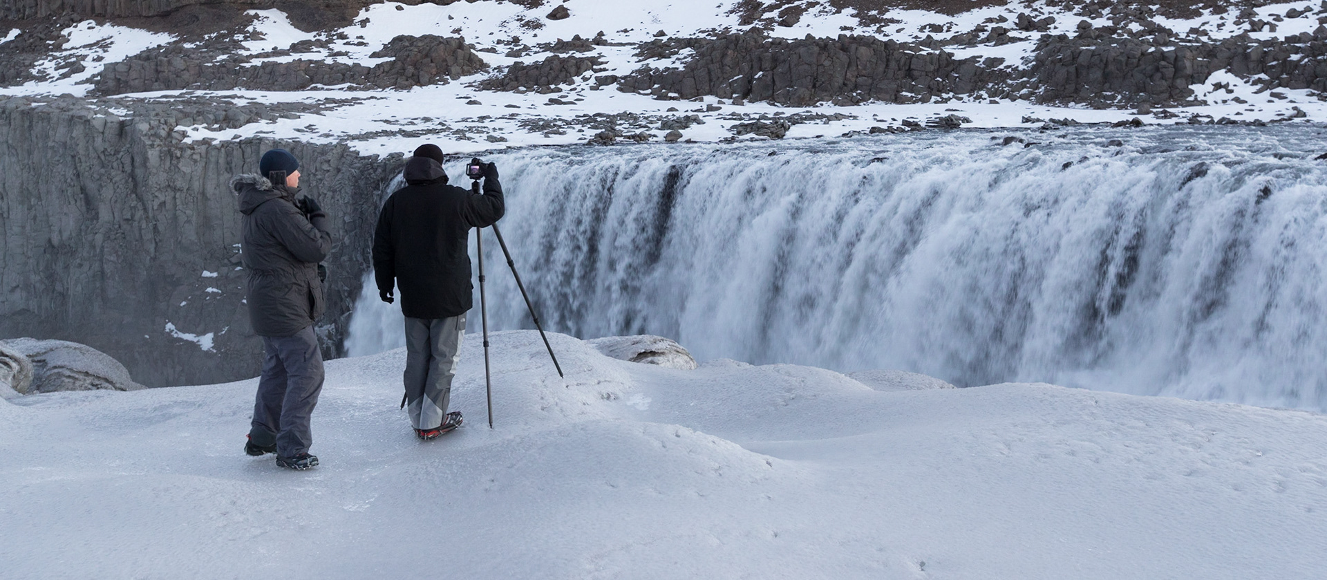 David Clapp and another colleague photographing Hrafnabjargarfoss Waterfall In Northern Iceland