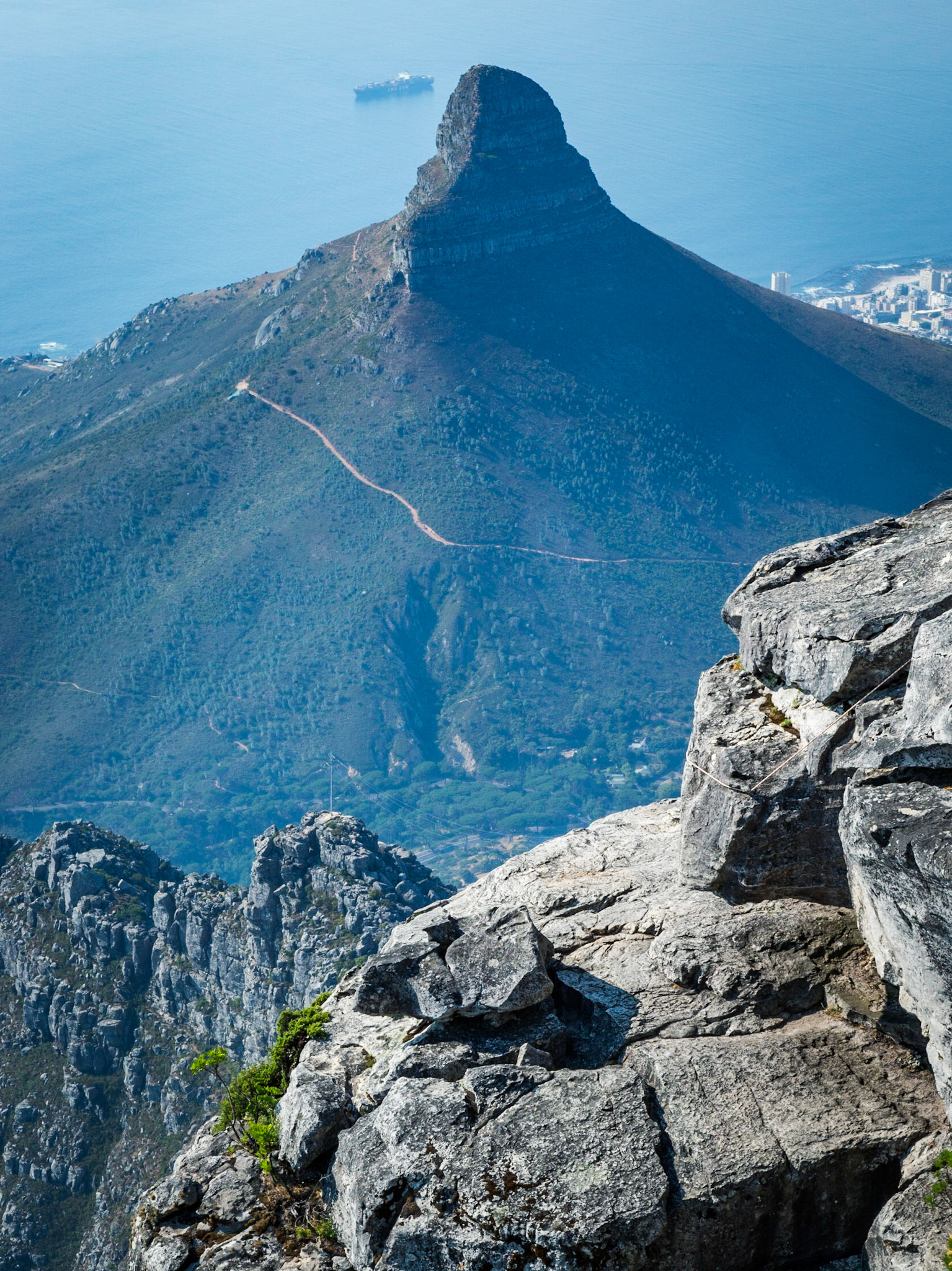 Lion's Head is a mountain in Cape Town, South Africa, between Table Mountain and Signal Hill. Lion's Head peaks at 669 metres (2,195 ft) above sea level. The peak forms part of a dramatic backdrop to the city of Cape Town and is part of the Table Mountain National Park.