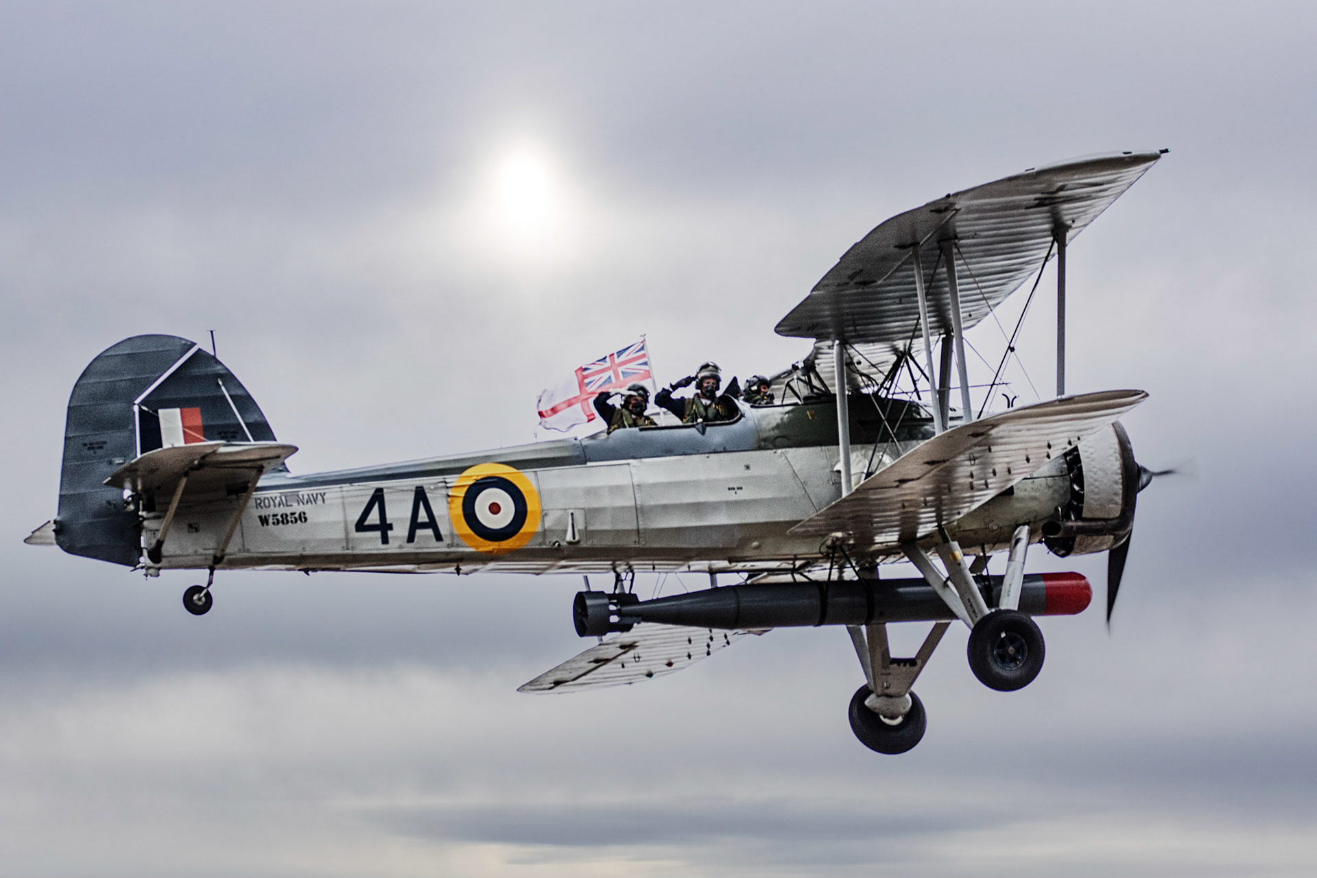 The Fairey Swordfish was a biplane torpedo bomber designed by the Fairey Aviation Company, used by the Fleet Air Arm of the Royal Navy during World War II. Originating in the 1930s, the Swordfish, nicknamed "Stringbag", was an outdated design by the start of the war in 1939, but remained in front-line service until V-E Day, outliving several types intended to replace it. It was initially operated primarily as a fleet attack aircraft; during its later years it was used as an anti-submarine and training craft.The Swordfish achieved some spectacular successes, notably the sinking of one and damaging two battleships of the Regia Marina (the Italian Navy) in the Battle of Taranto and the famous crippling of the Bismarck.
