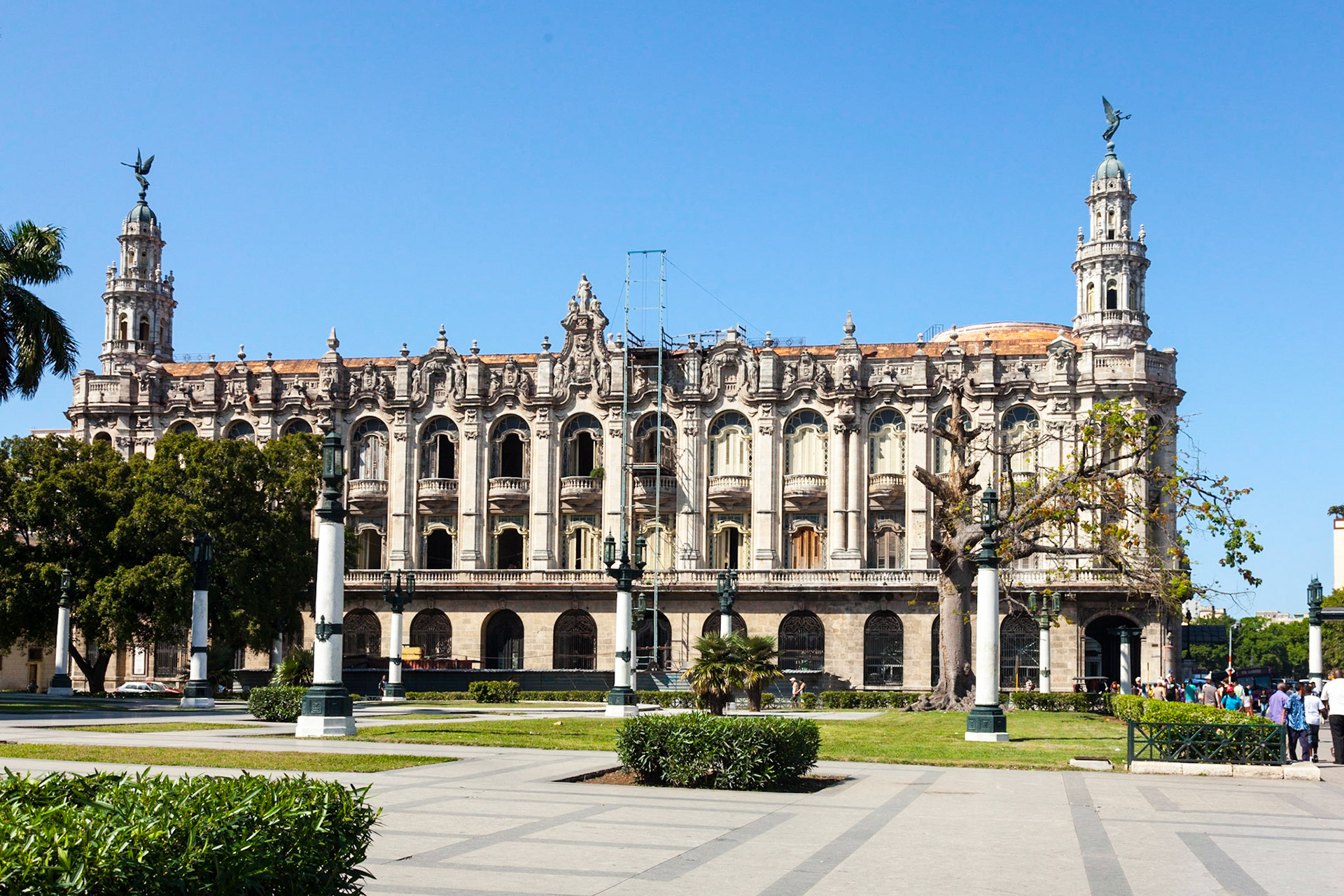 Gran Teatro de La Habana, Havana, Cuba.  Visitors may not expect to find one of the world's largest opera houses in the middle of the Caribbean, but the magnificent Gran Teatro de La Habana is just that. For those who have the chance, attending a performance here is a memorable experience. Designed by Belgian architect, Paul Belau, the theater faces Parque Central and was built as part of a larger complex in 1915. Art aficionados will be pleasantly surprised by the beautiful baroque façade, which features four stunning sculptures created by the master, Giuseppe Moretti.  Over the years, the Gran Teatro de La Habana has hosted a wide variety of performances by some of the most famous celebrities in the world. Today, the theater is home to Cuba's National Ballet and Opera.