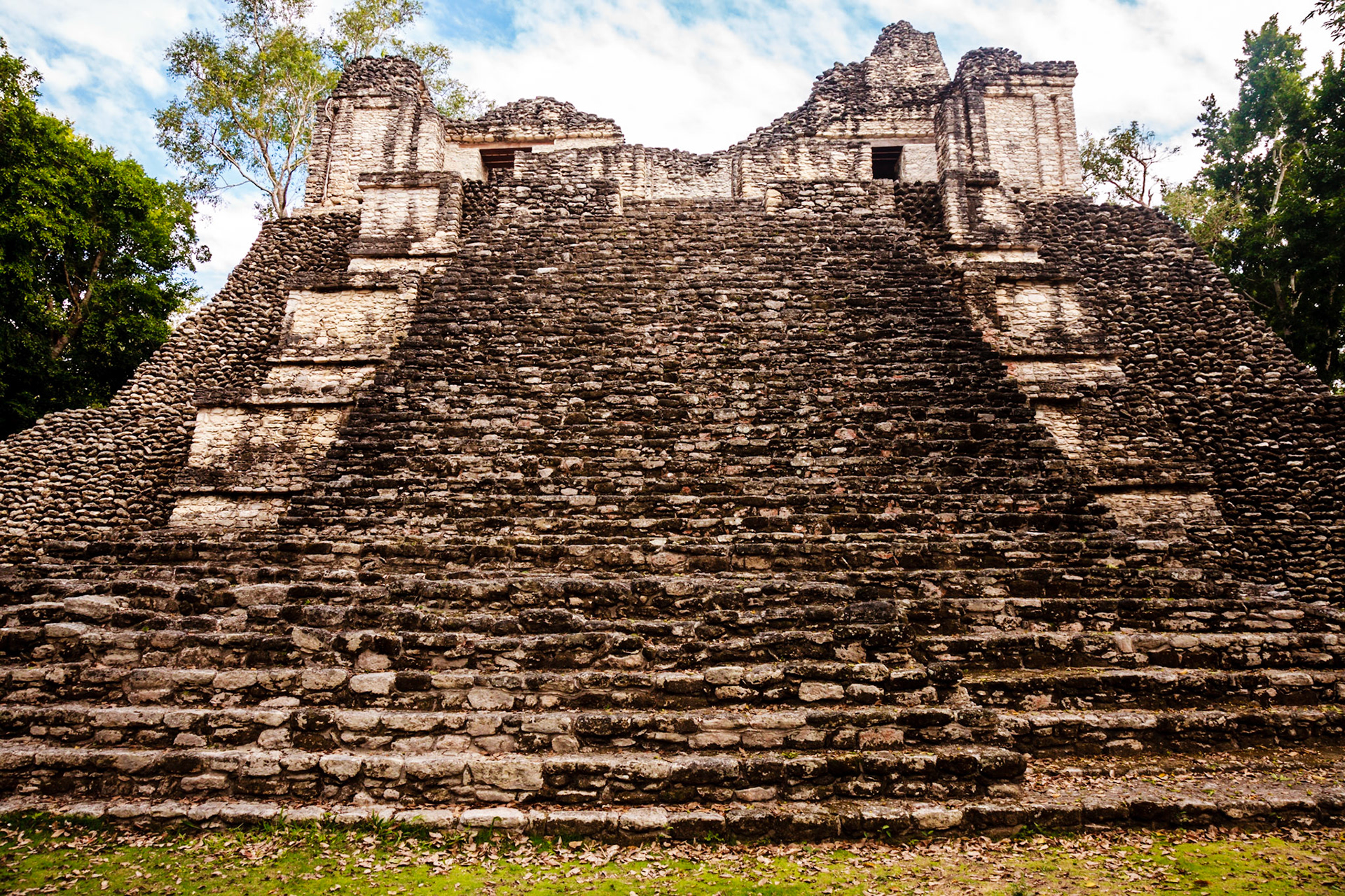 Kohunlich (X-làabch'e'en in Modern Mayan) is a large archaeological site of the pre-Columbian Maya civilization, located on the Yucatán Peninsula in the state of Quintana Roo about 25 km east of the Rio Bec region, and about 65 km west of Chetumal on Highway 186, and 9 km south of the road. The Spanish name does not actually derive from Mayan but from the English Cohune Ridge where cohune palm grew.