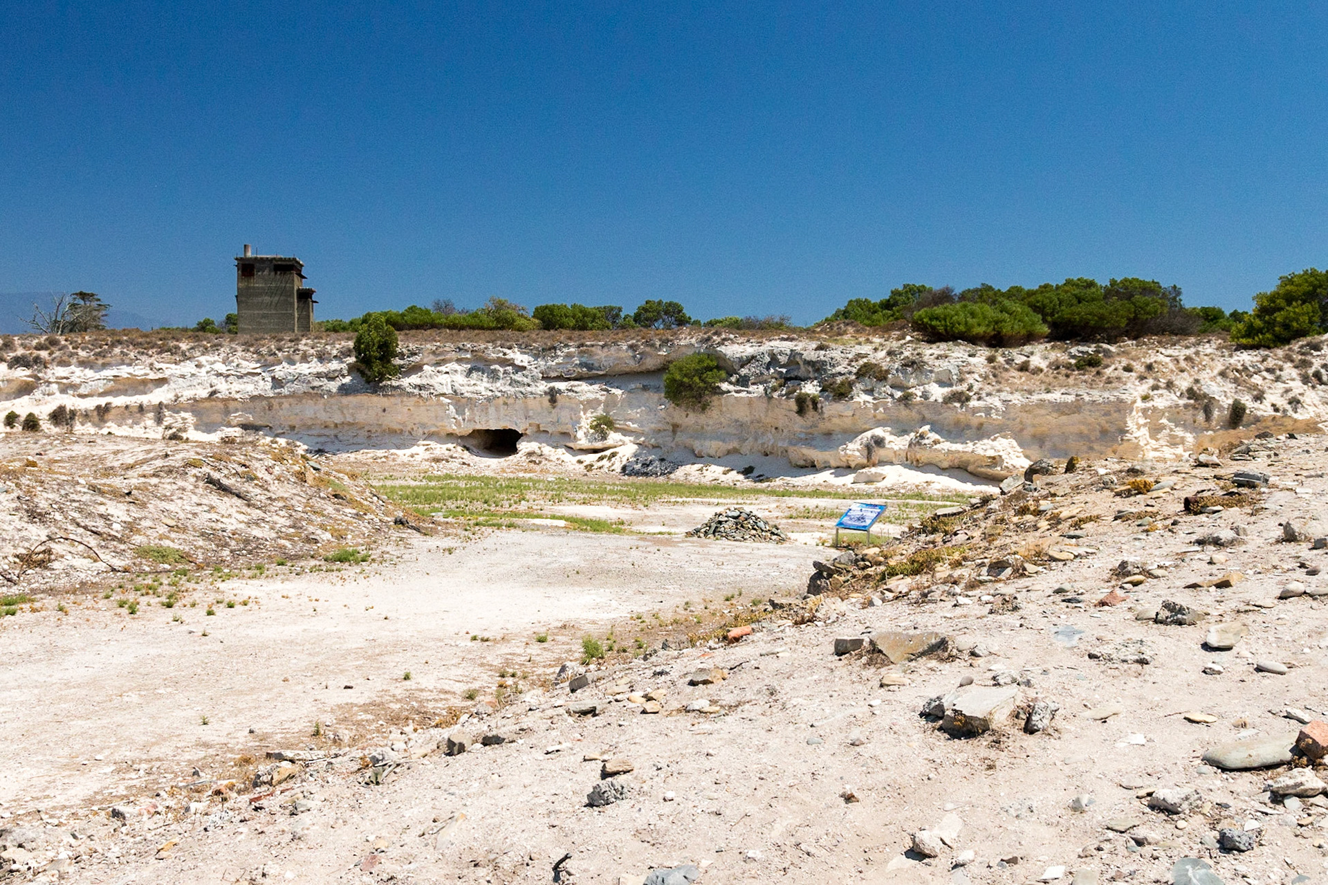 Robben Island is an island in Table Bay, 6.9 km west of Cape Town, South Africa. Robben Island is roughly oval in shape, 3.3 km long north-south, and 1.9 km wide, with an area of 5.07 km². It is flat and only a few metres above sea level. Nobel Laureate and former President of South Africa Nelson Mandela was imprisoned there for 18 of the 27 years he served behind bars before the fall of apartheid. Robben Island is both a South African National Heritage Site as well as a UNESCO World Heritage Site. The Island was used as a prison for political prisoners and convicted criminals from 1961. It was a maximum security prison for political prisoners until 1991. The medium security prison for criminal prisoners was closed in 1996.