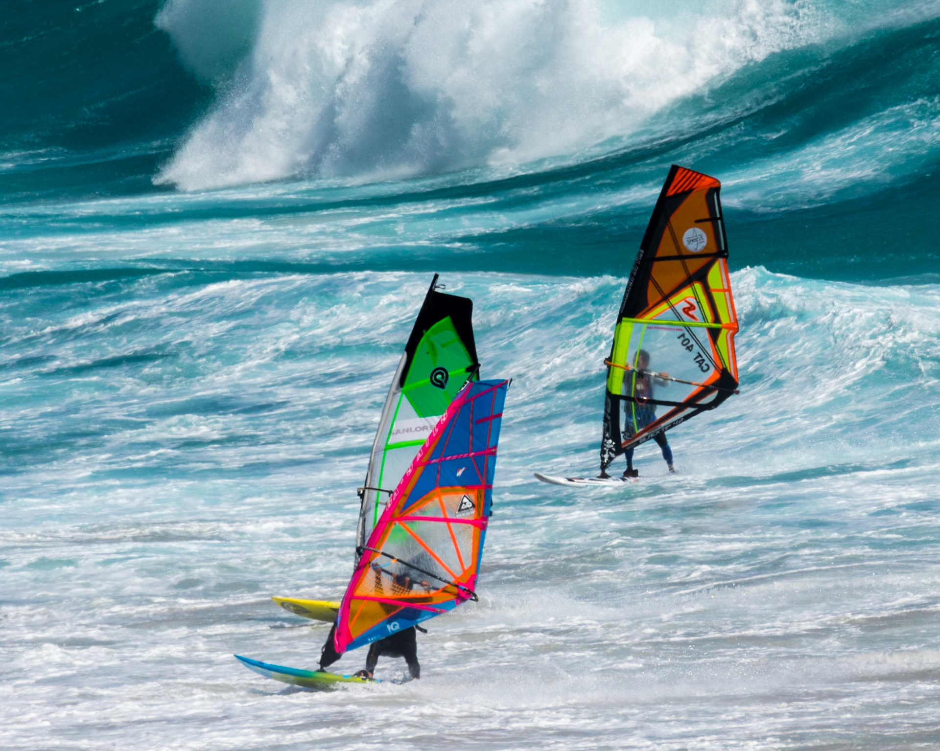 Windsurfing can be said to straddle both the laid-back culture of surf sports and the more rules-based environment of sailing. Although it might be considered a minimalistic version of a sailboat, windsurfing offers experiences that are outside the scope of other sailing craft designs. Windsurfers can perform jumps, inverted loops, spinning maneuvers, and other "freestyle" moves that cannot be matched by any sailboat.