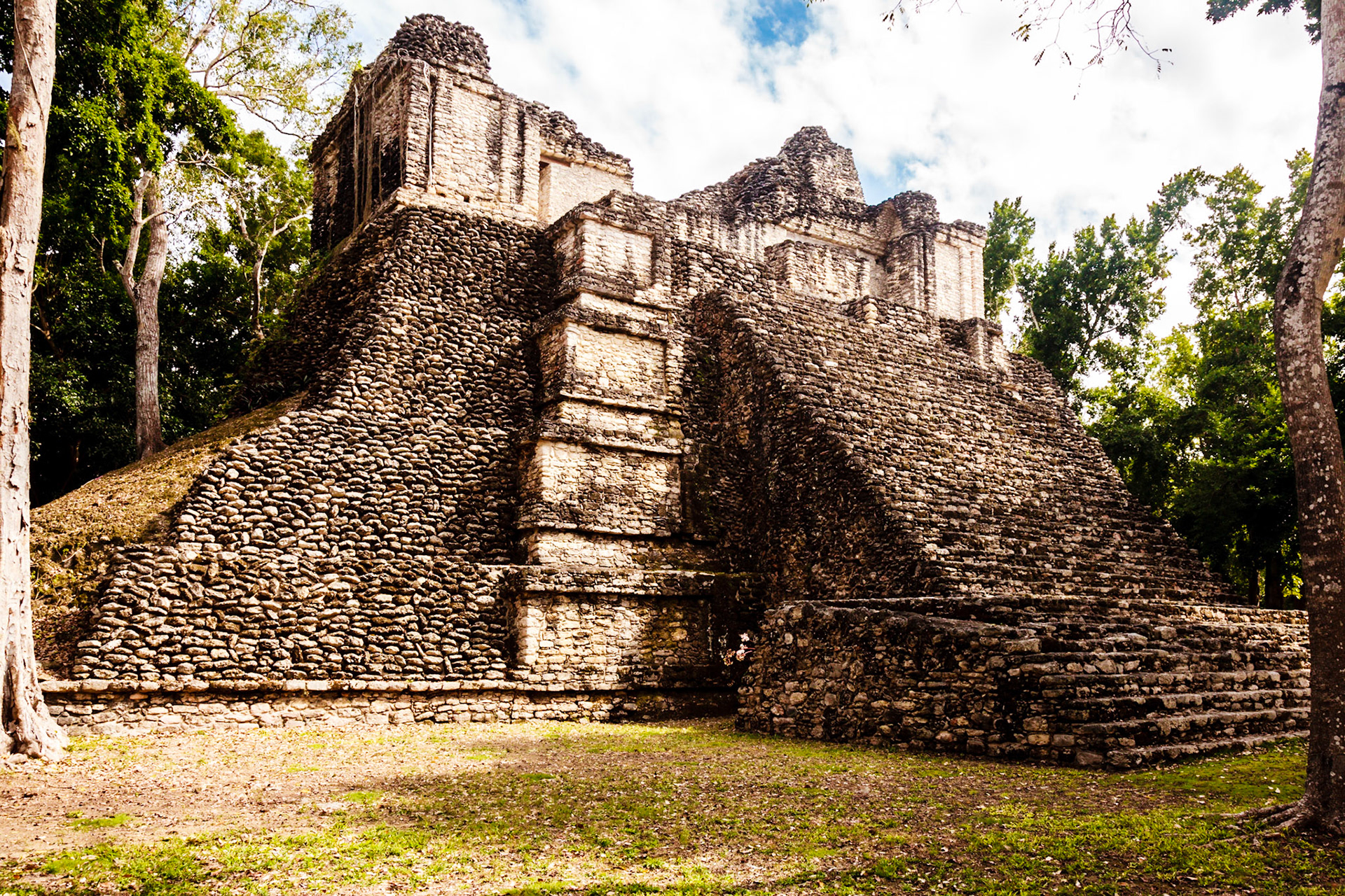 Kohunlich (X-làabch'e'en in Modern Mayan) is a large archaeological site of the pre-Columbian Maya civilization, located on the Yucatán Peninsula in the state of Quintana Roo about 25 km east of the Rio Bec region, and about 65 km west of Chetumal on Highway 186, and 9 km south of the road. The Spanish name does not actually derive from Mayan but from the English Cohune Ridge where cohune palm grew.